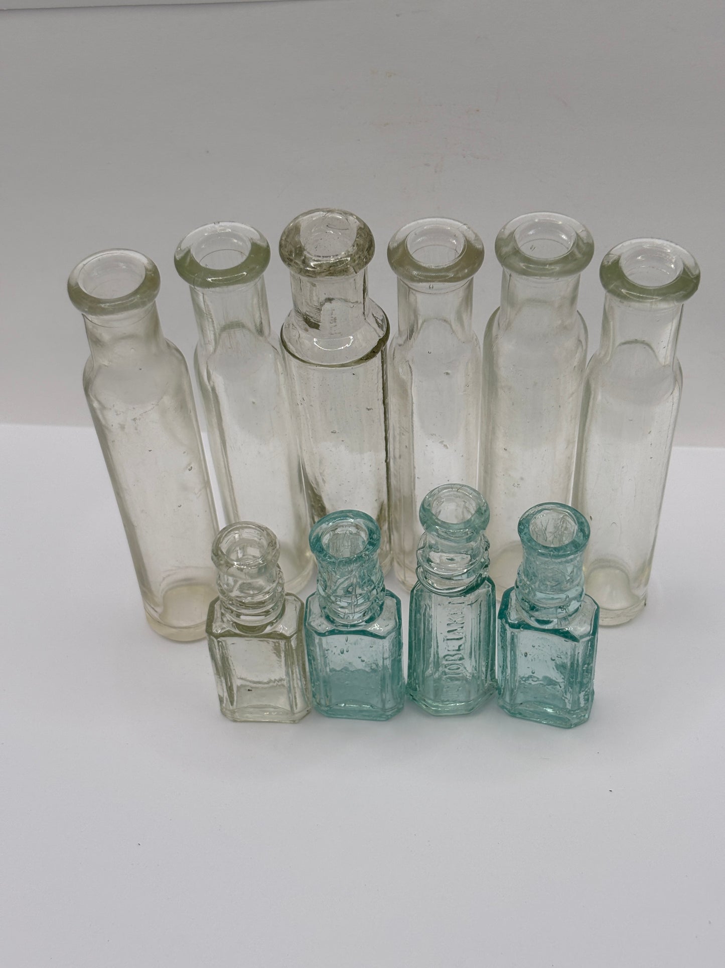 9 old glass bottles, vials, chemist bottles