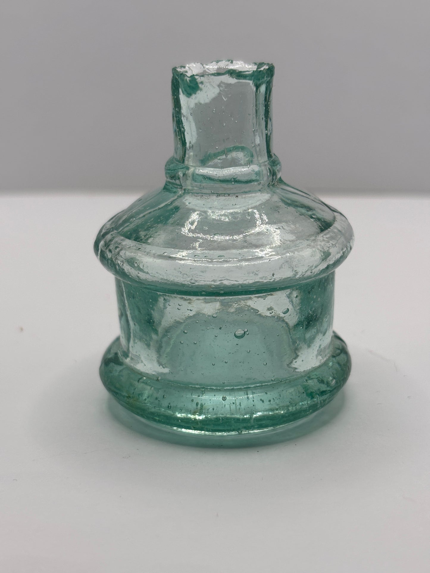 Old aqua glass advertising inkwell, ink bottle. Pridge