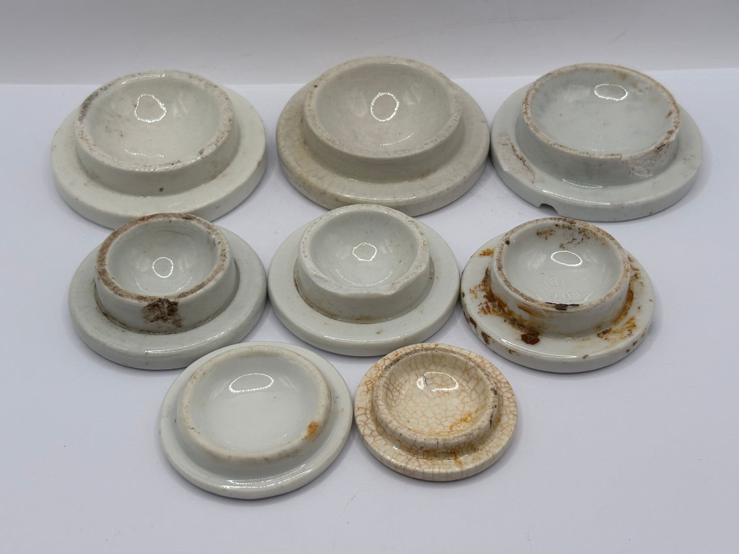 8 stoneware lids, stacking lids. Damaged