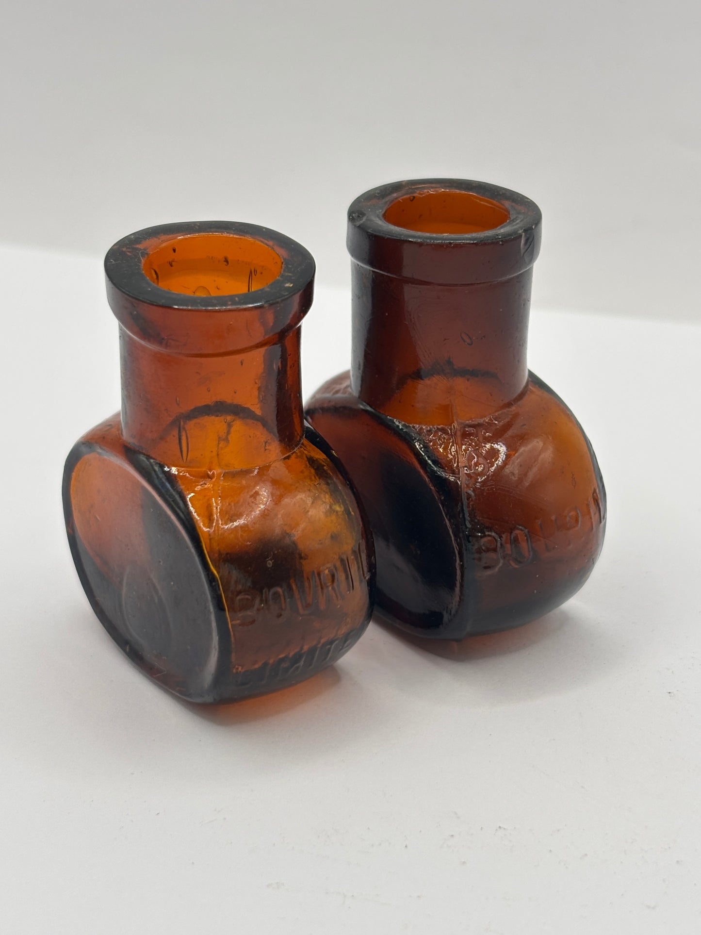 2 old mini bovril bottles