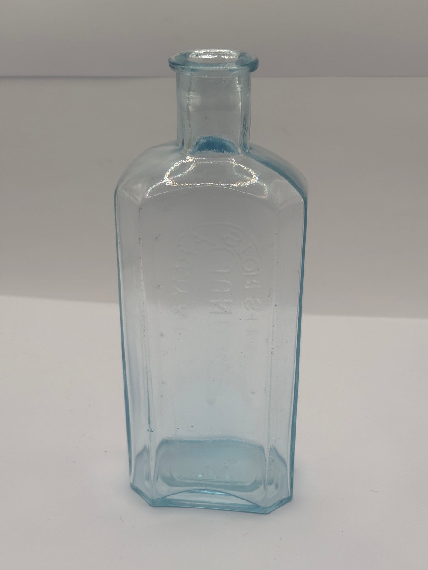 Old advertising chemist bottle. Army & navy junior stores