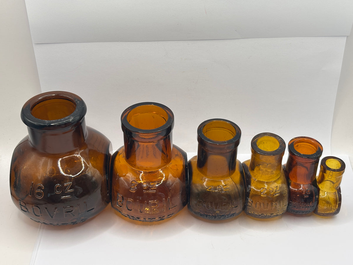 Full Set of 6 old amber glass Bovril bottles. 16oz- 0.5oz
