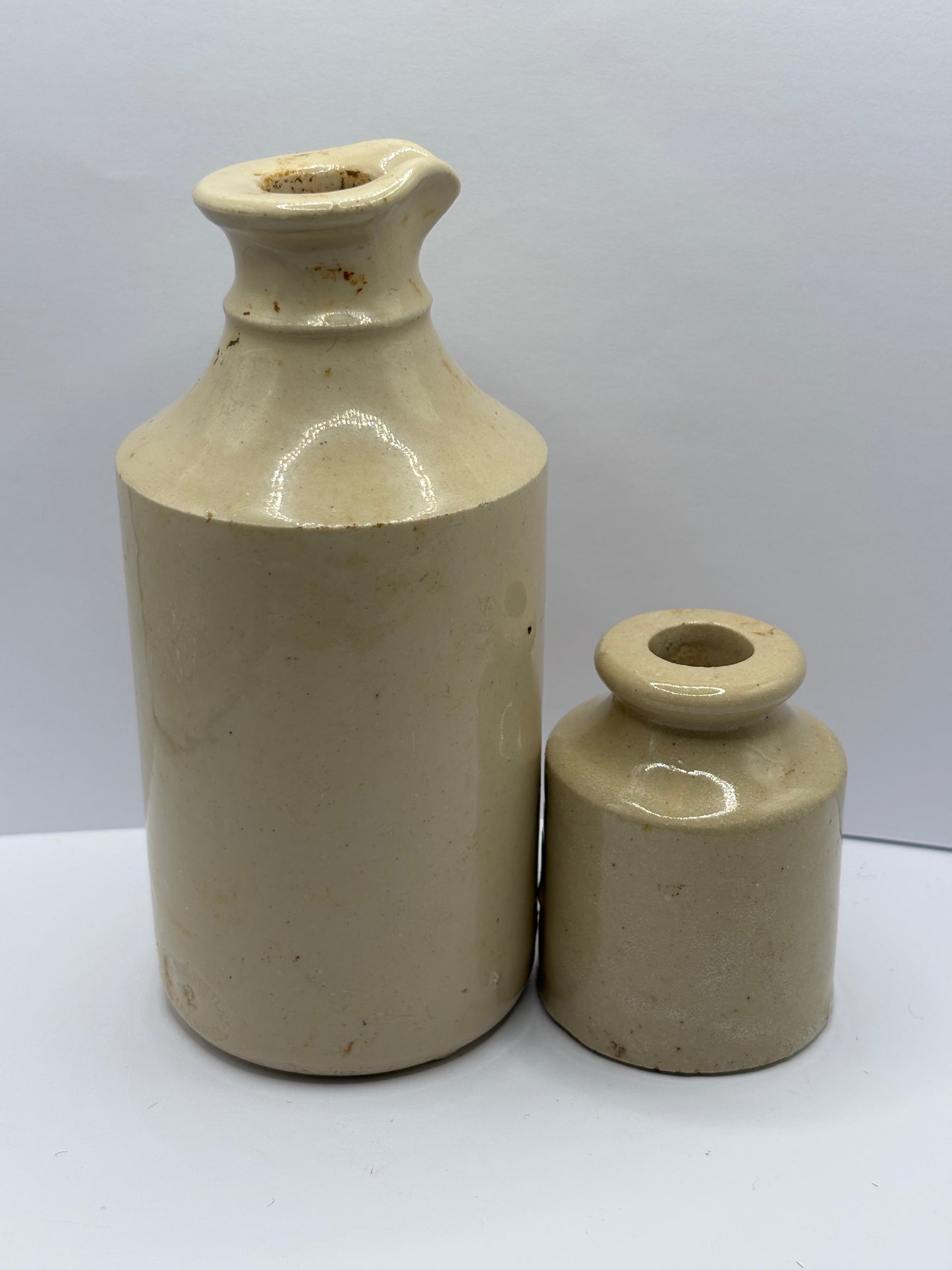 2 old white stoneware bottles