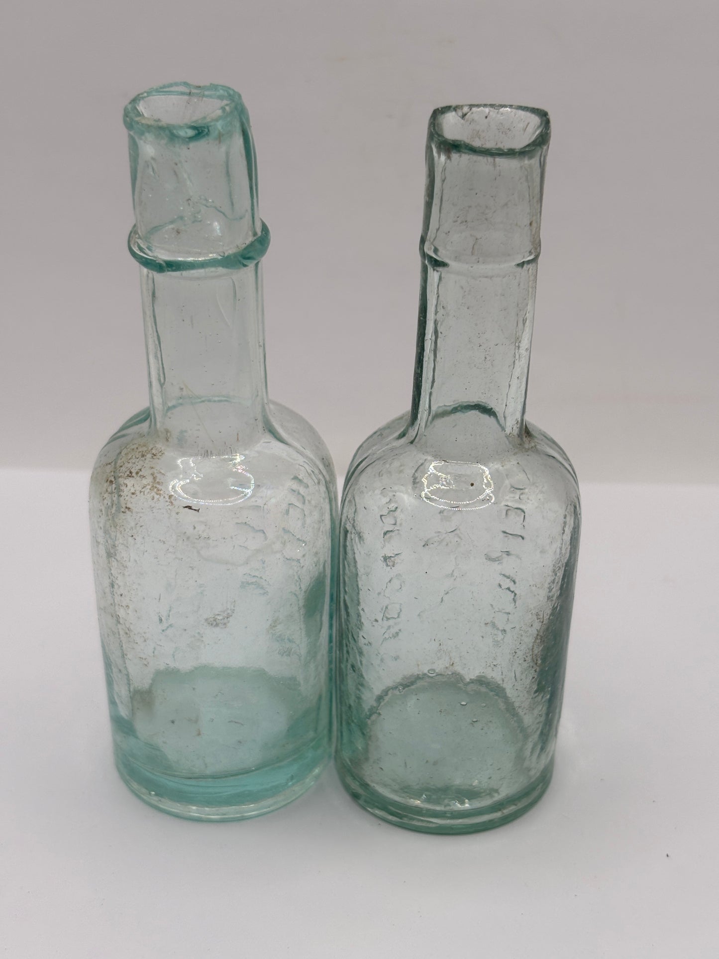 2 old aqua glass Henderson’s relish bottles