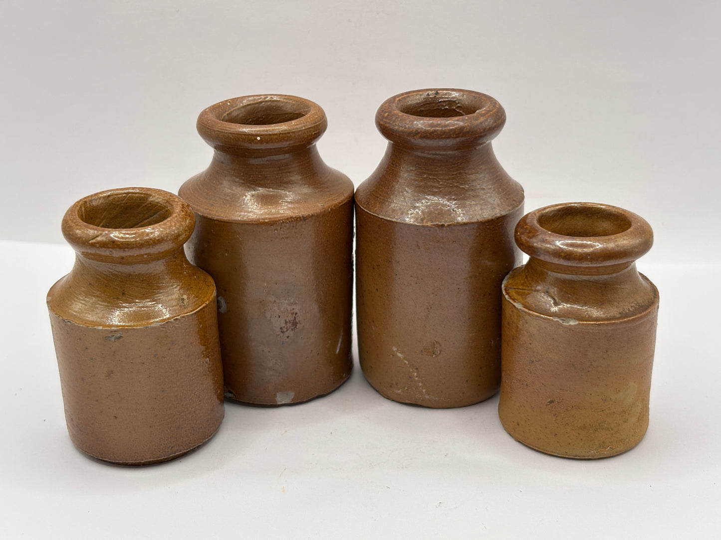 4 old small brown stoneware jars