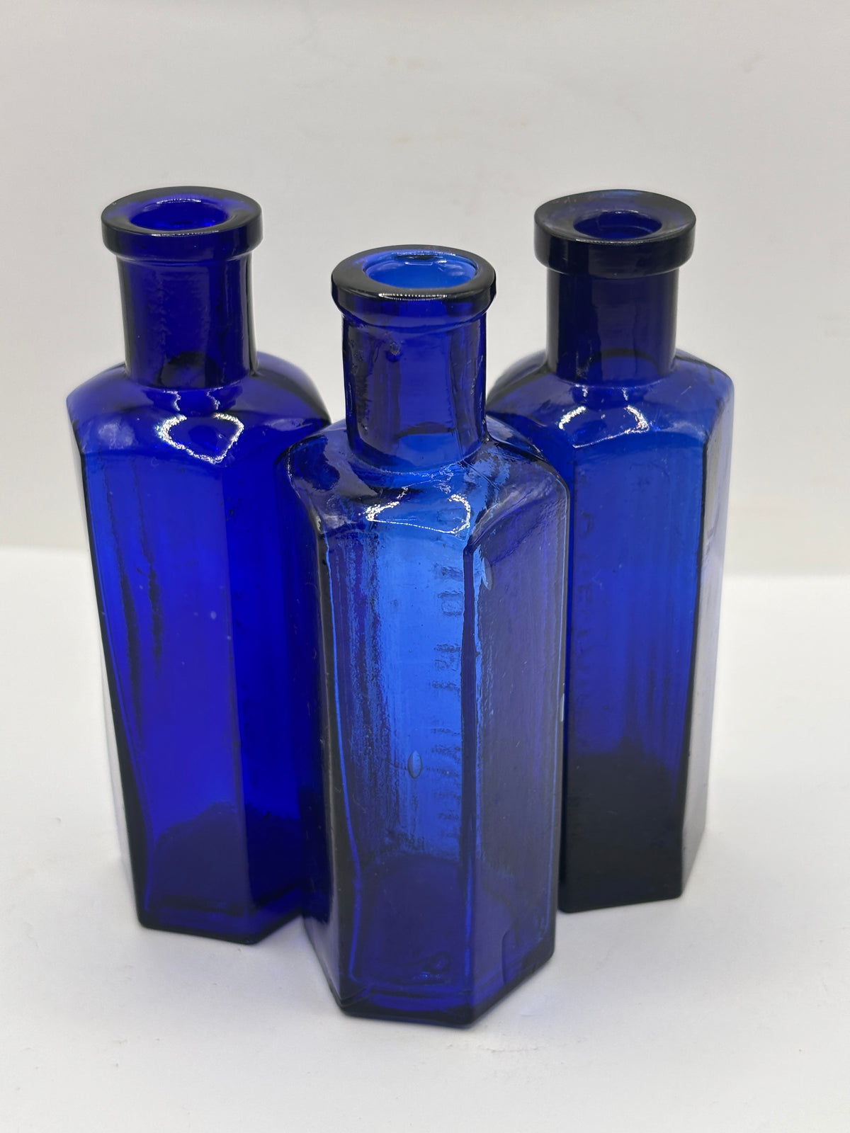 3 old small blue ribbed poison bottles, not to be taken