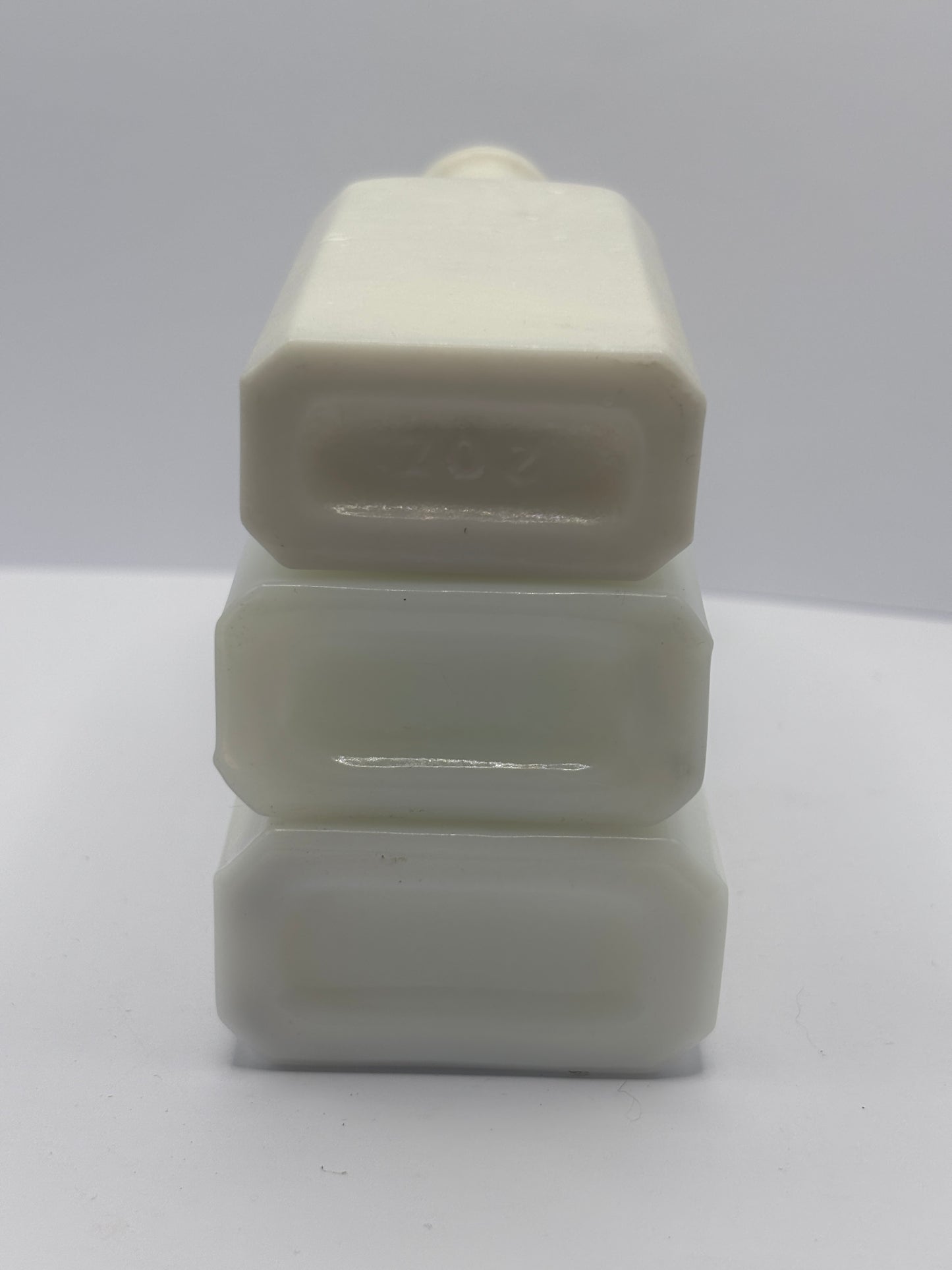 3 old white milk glass bottles