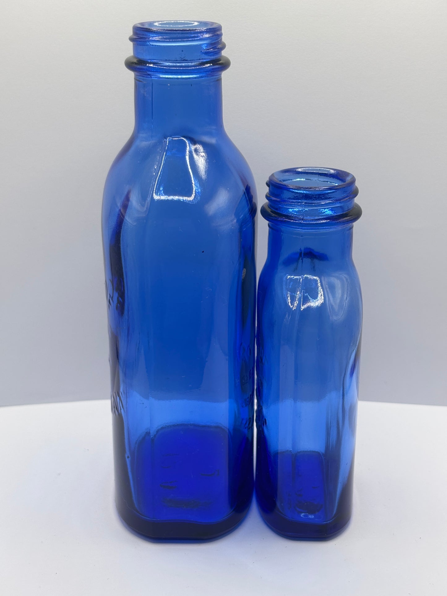 2 vintage Blue milk of magnesia bottles