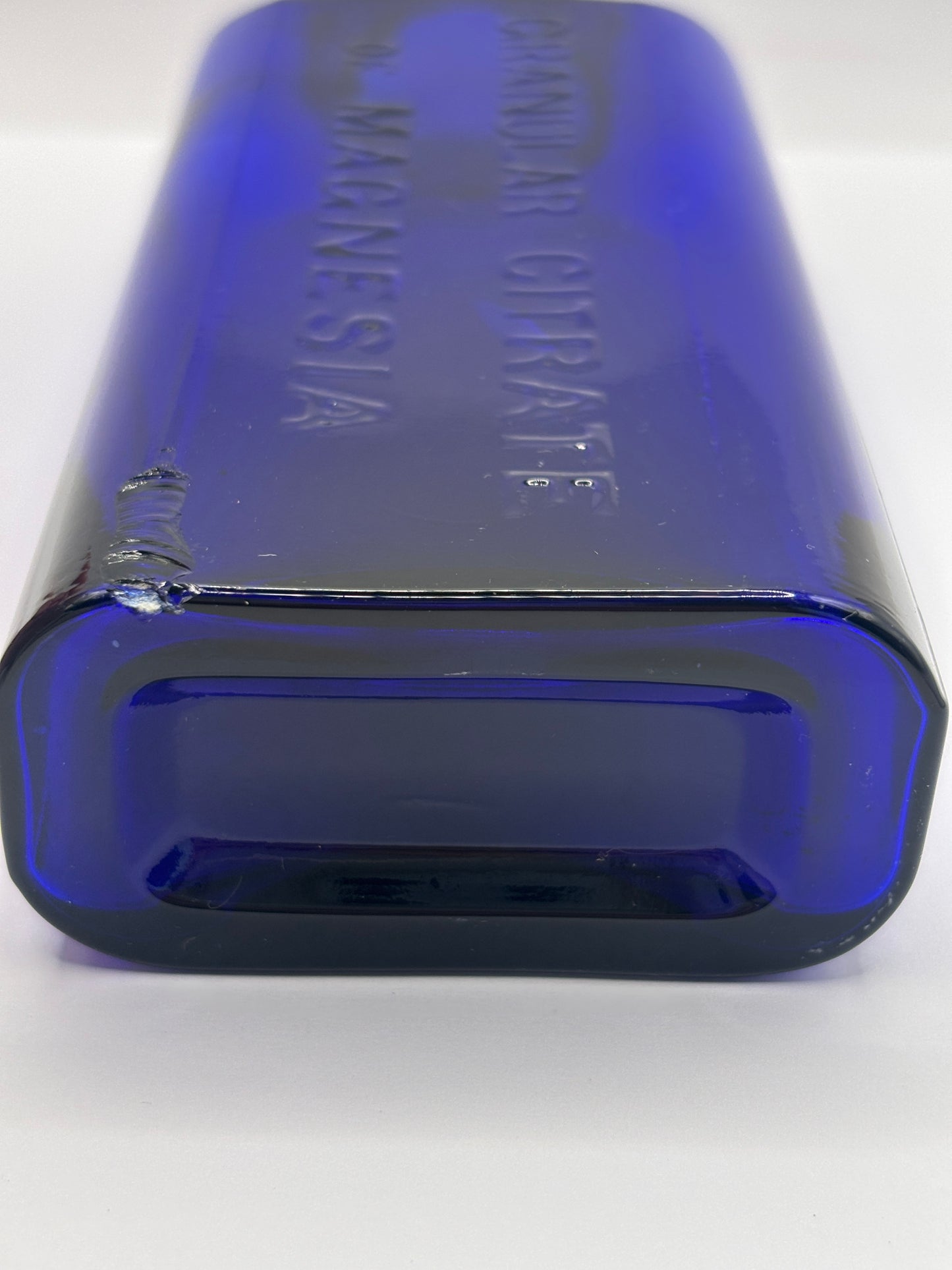 Old blue glass advertising bottle, Granular citrate of magnesia