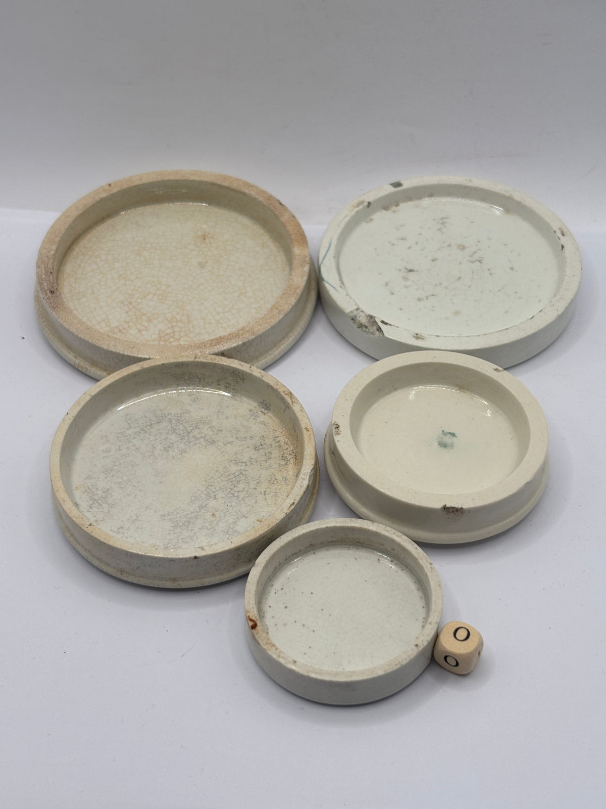5 old stoneware lids, stackers (o)