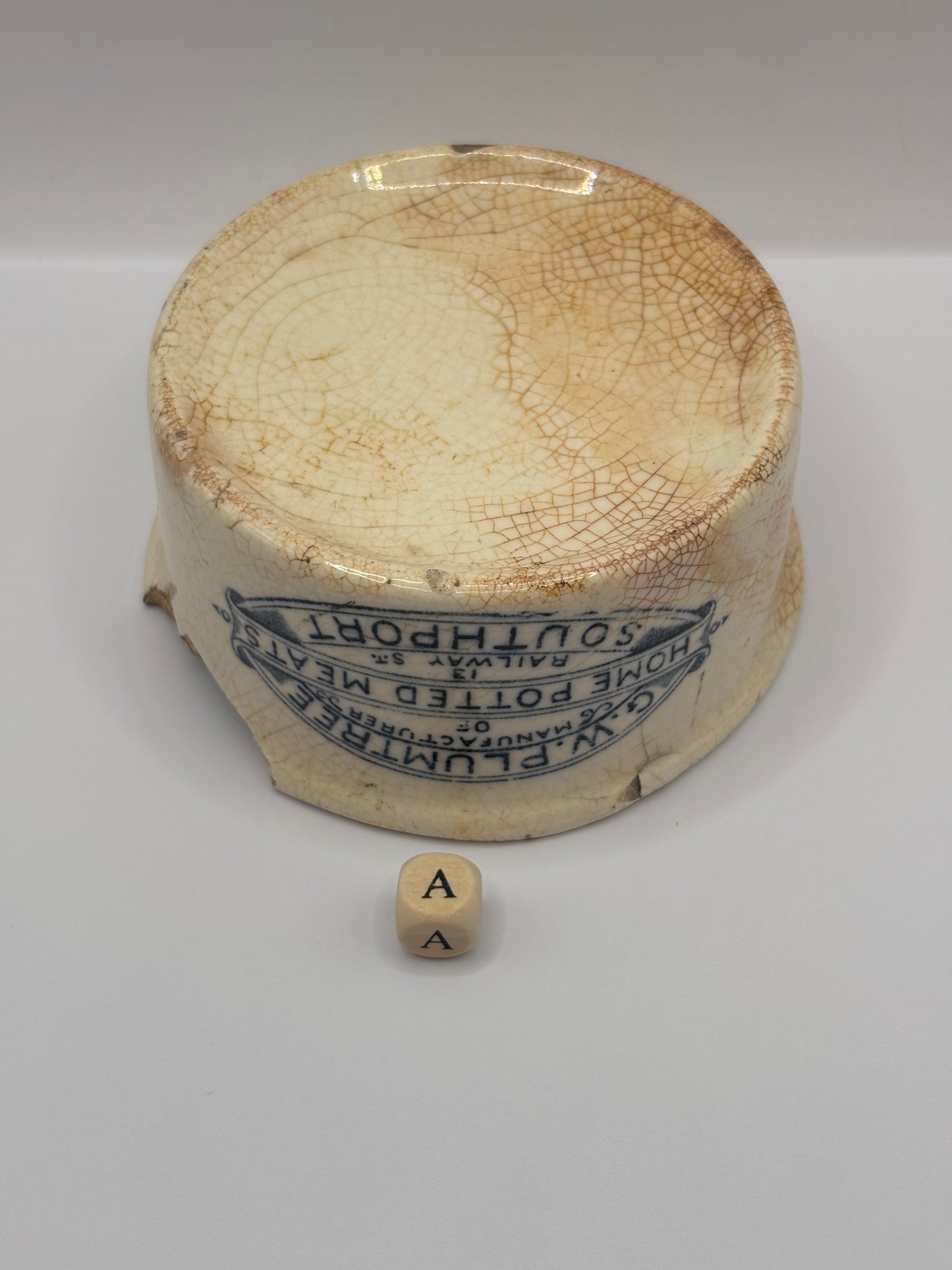 Old advertising meat paste pot, plumtrees (a) damaged