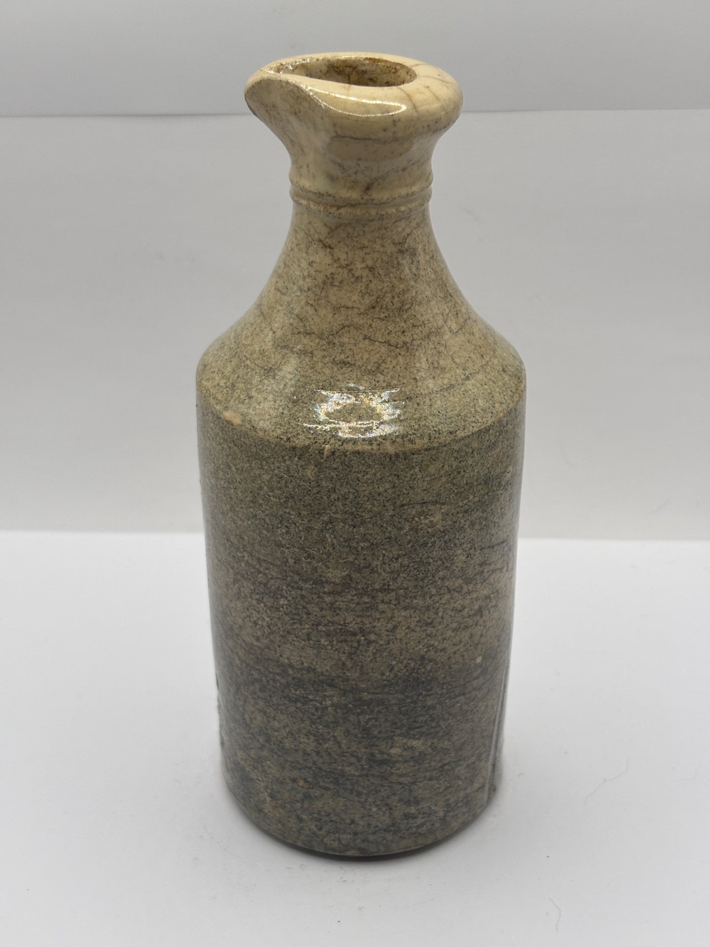 Old white stoneware pouring ink