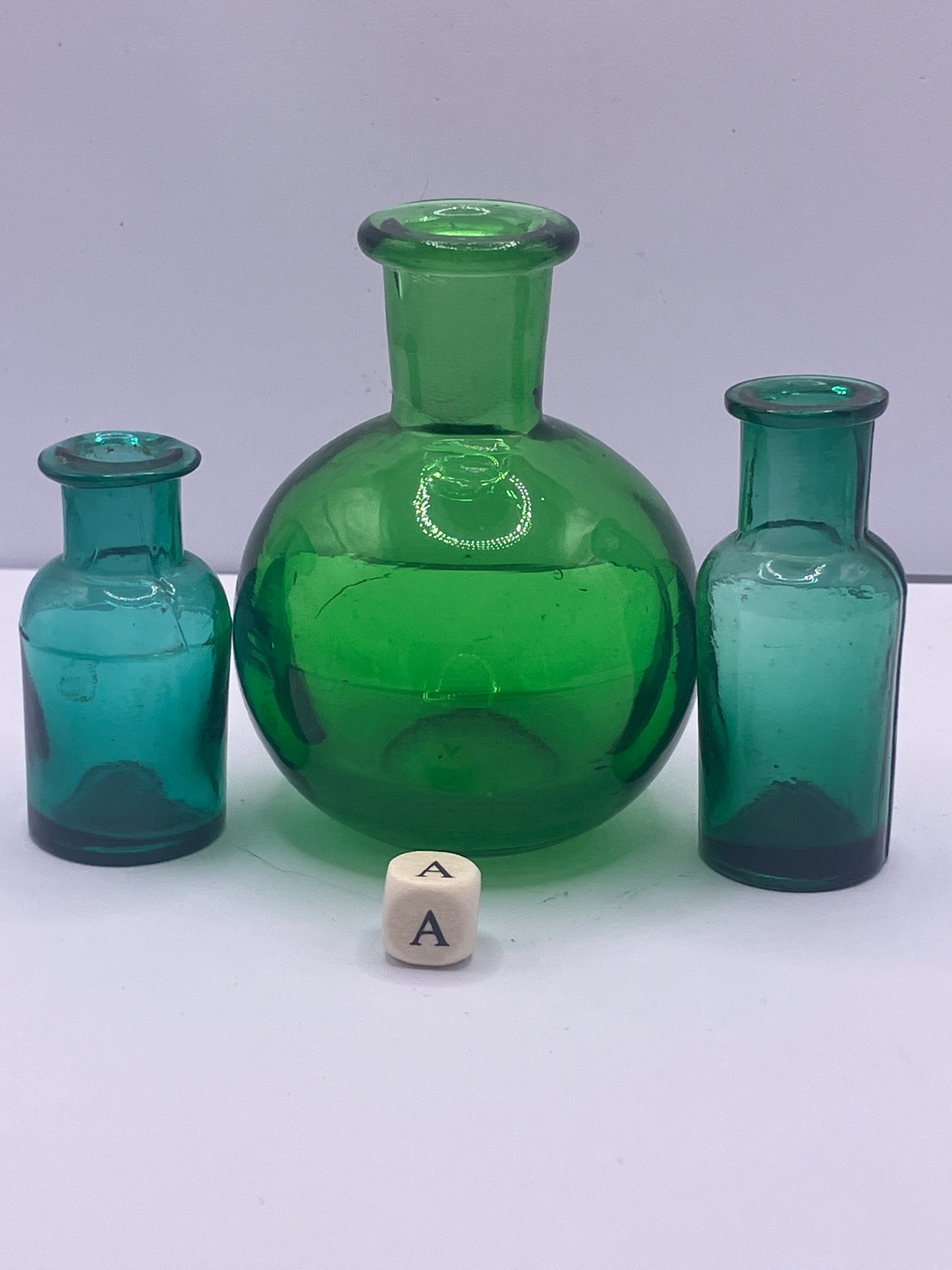 3 mini green glass bottles (a)