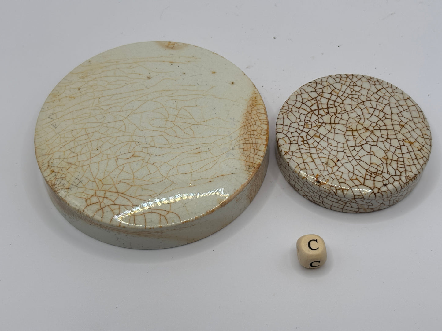 2 old stained & crazed stoneware lids