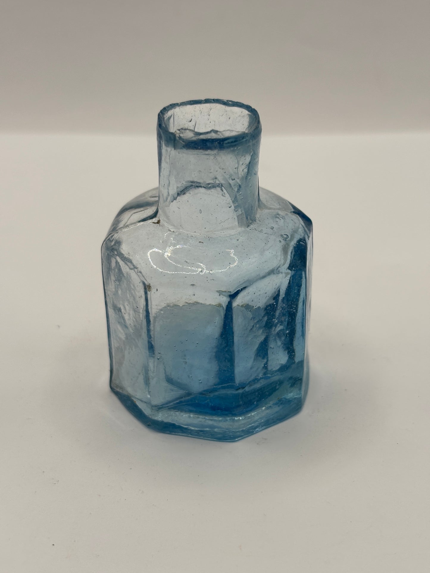 Old ice blue inkwell, ink bottle