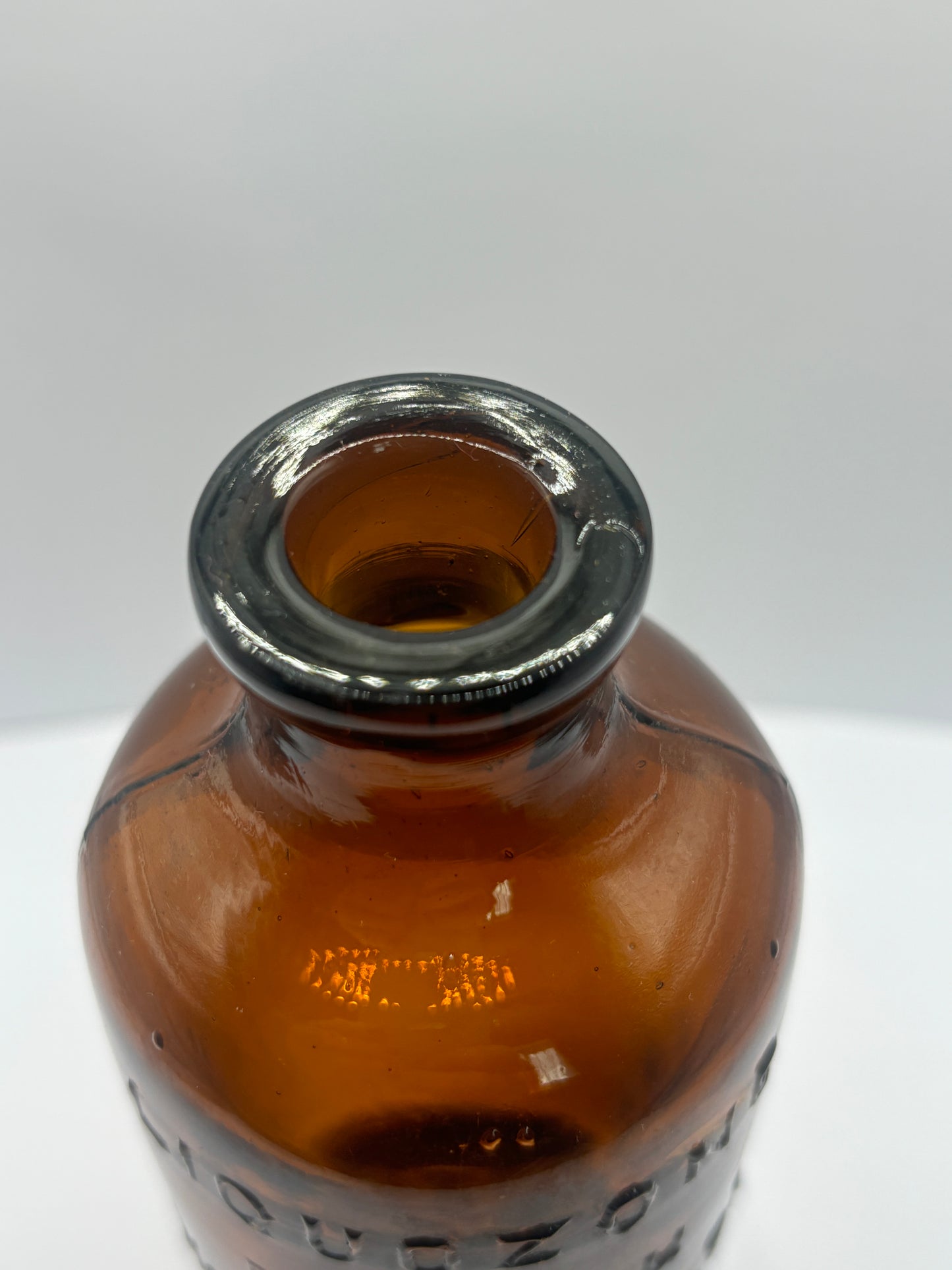 old amber glass liquozone bottle