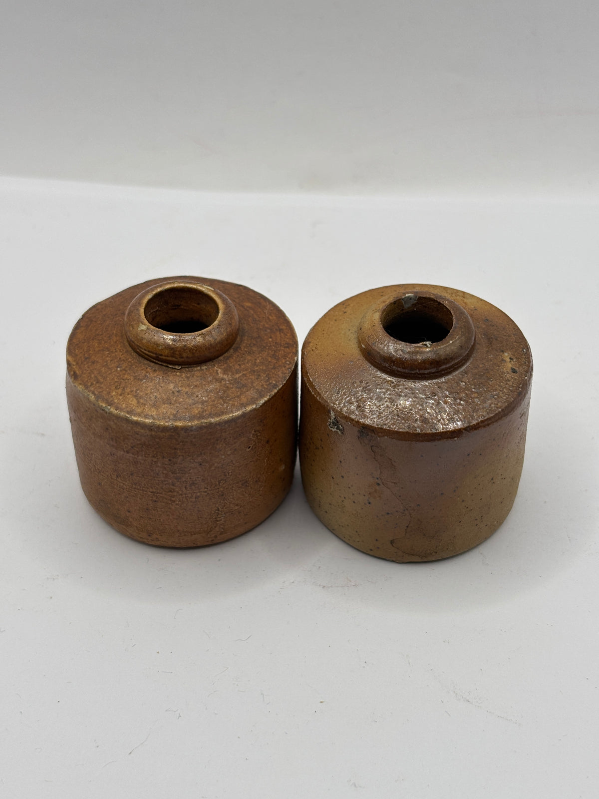2 Old stoneware ink bottles, inkwells, pork pies