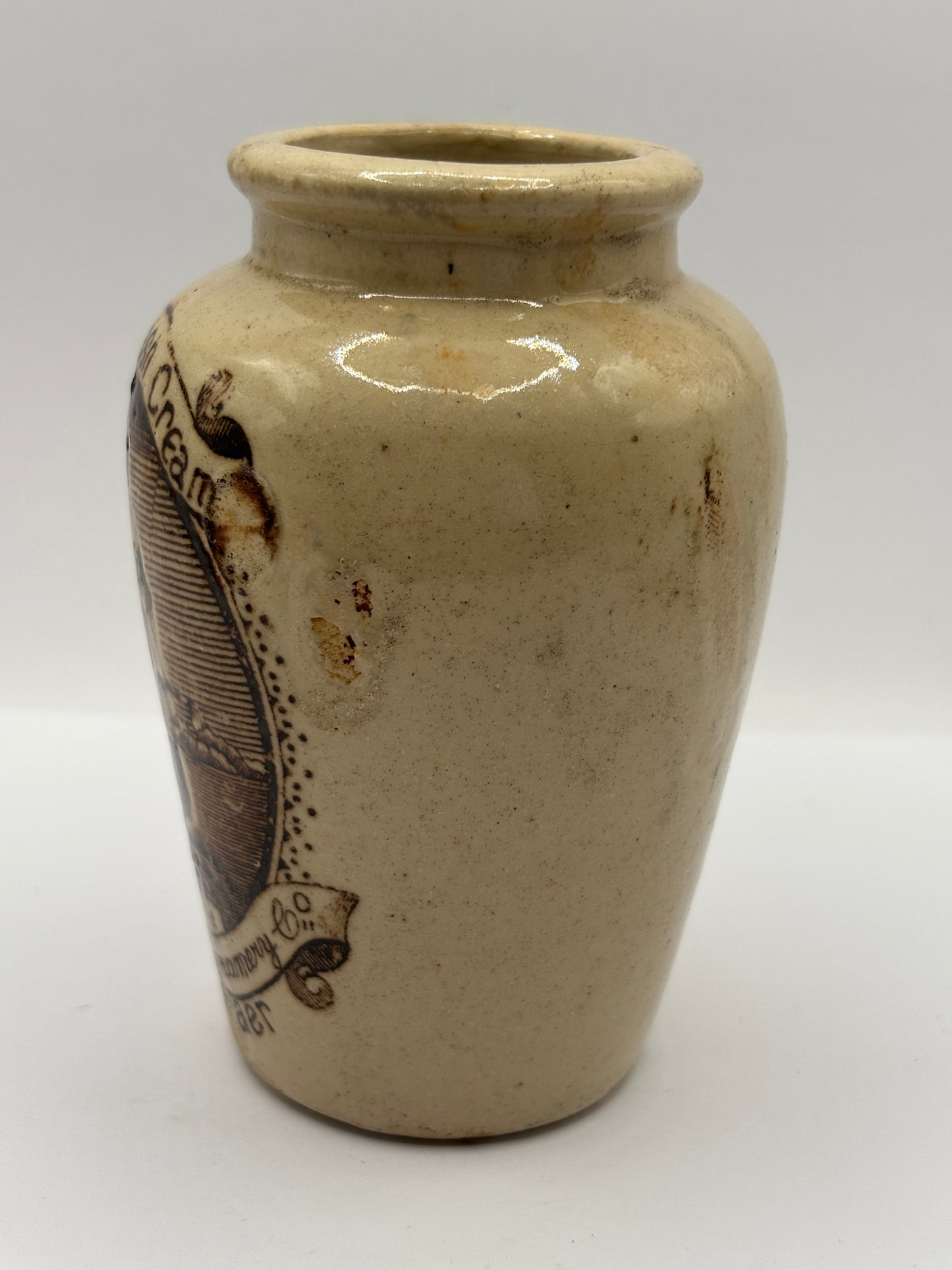 Old stoneware advertising cream pot, pure fresh cream Stranraer. Serpia print