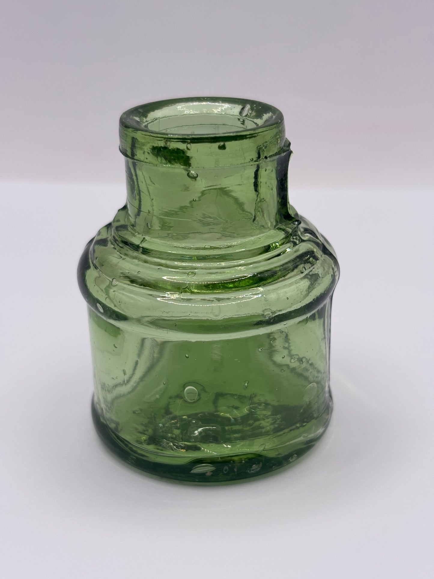 Old green glass ink bottle, inkwell