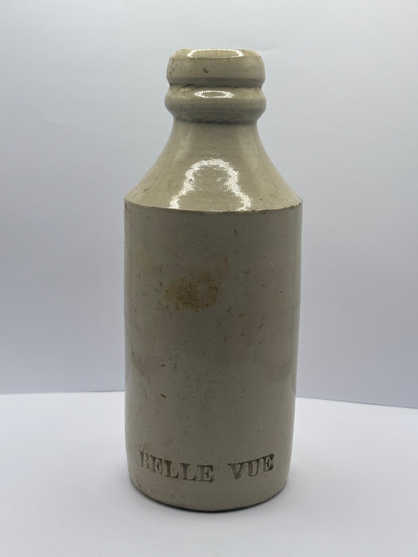 Old white stoneware Belle vue ginger beer bottle