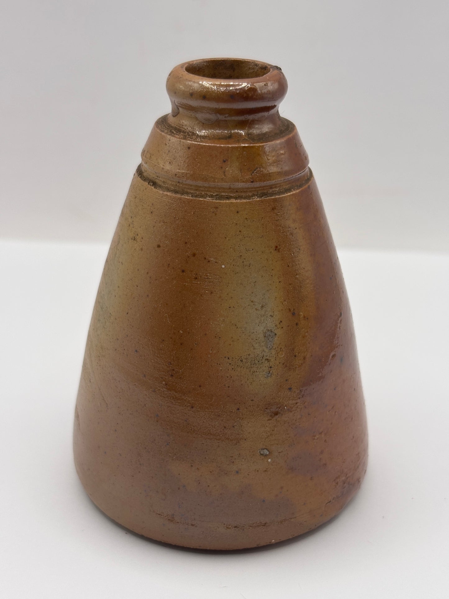 Old brown stoneware inkwell, ink bottle. Cone ink