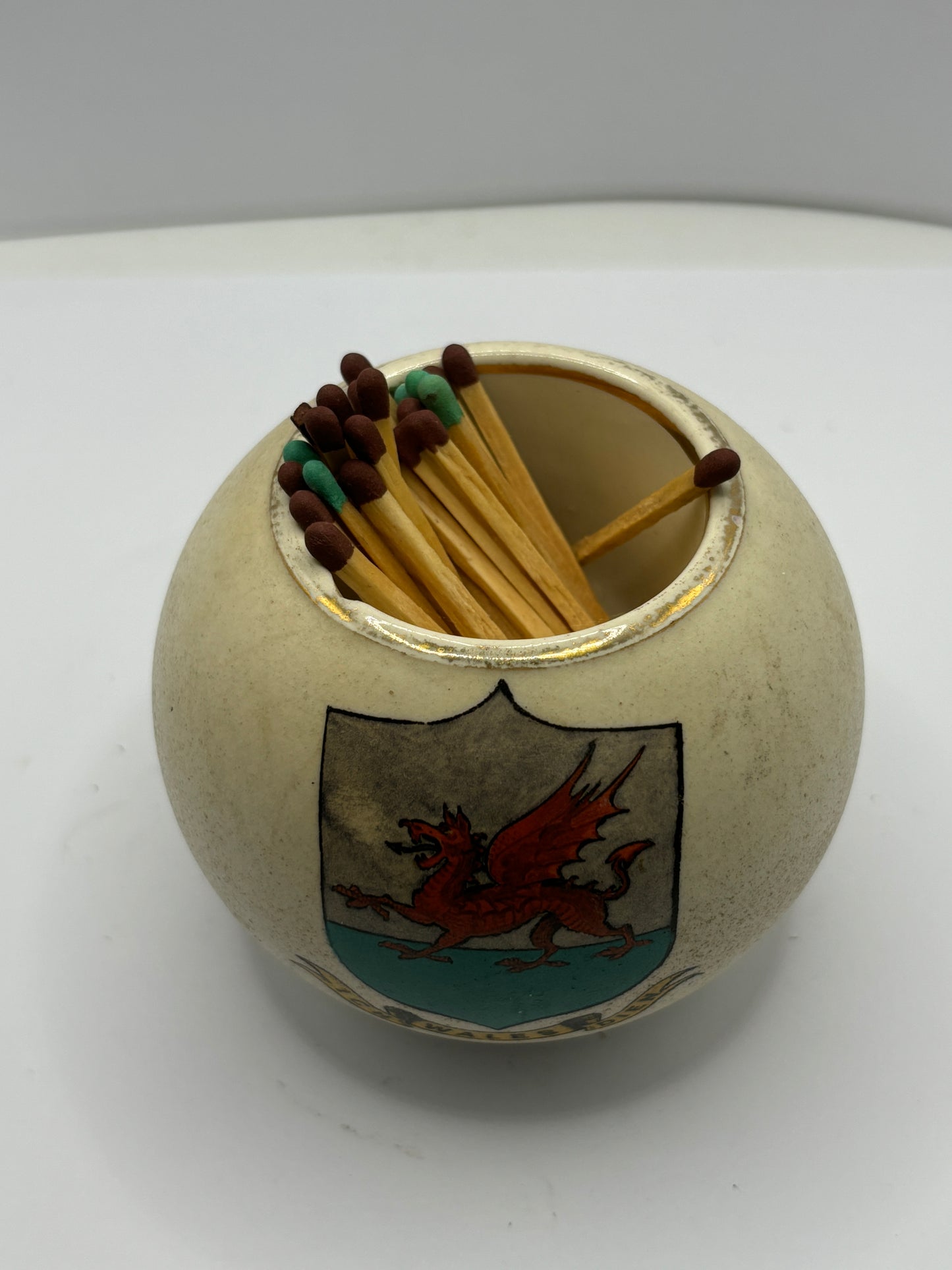 White carltonware matchstriker, Wales