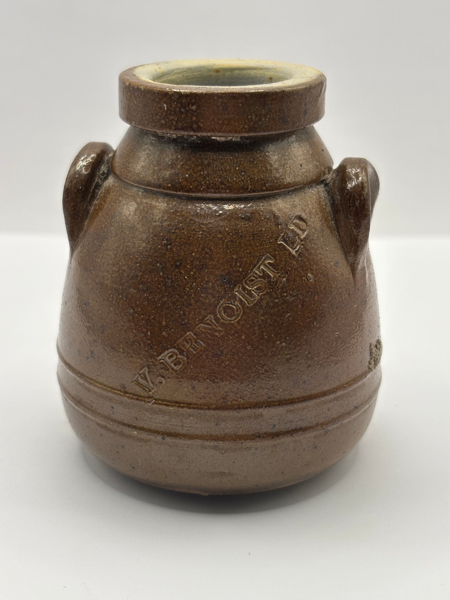 Old brown stoneware Benoist jar