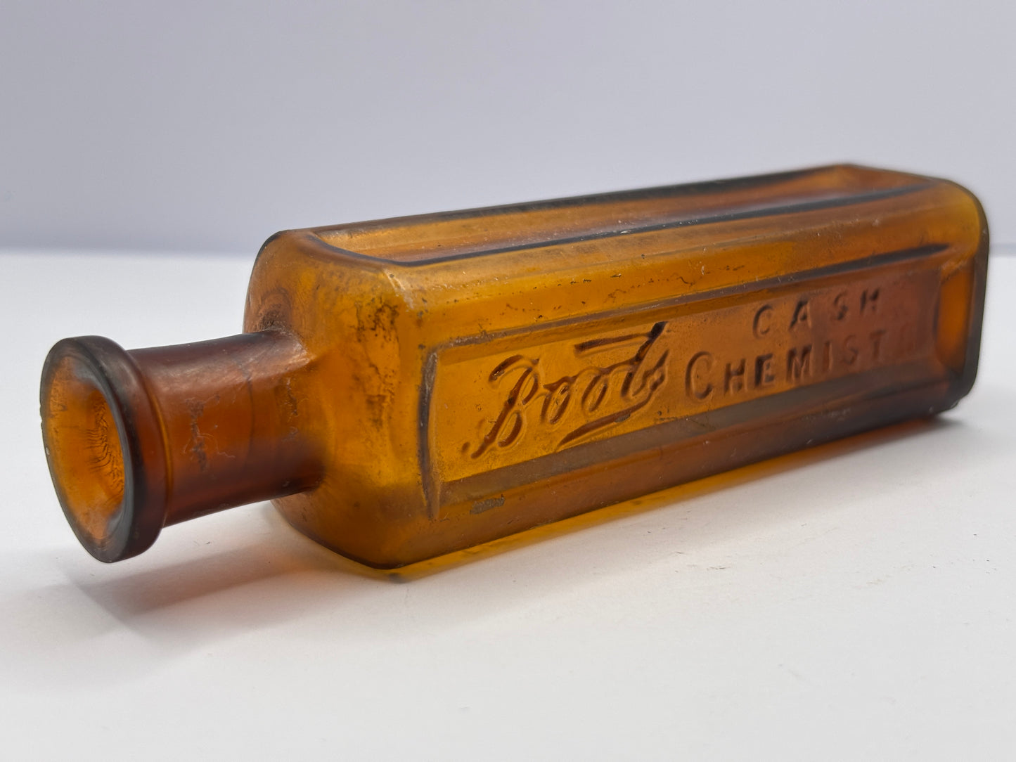 Old amber glass Boots cash chemists bottle