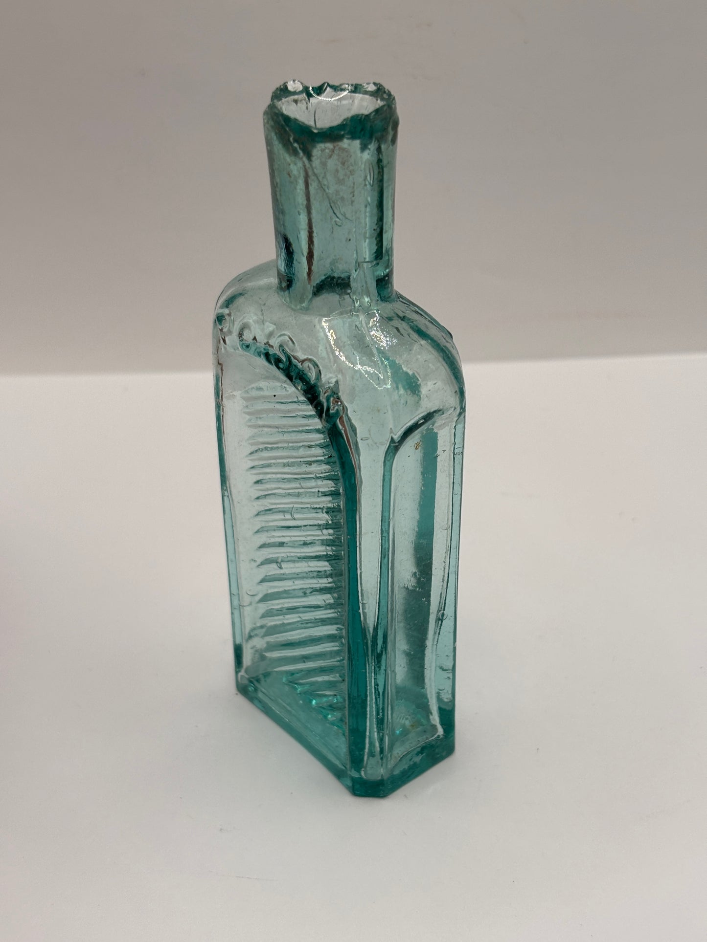 Old aqua glass poison bottle, not to be taken