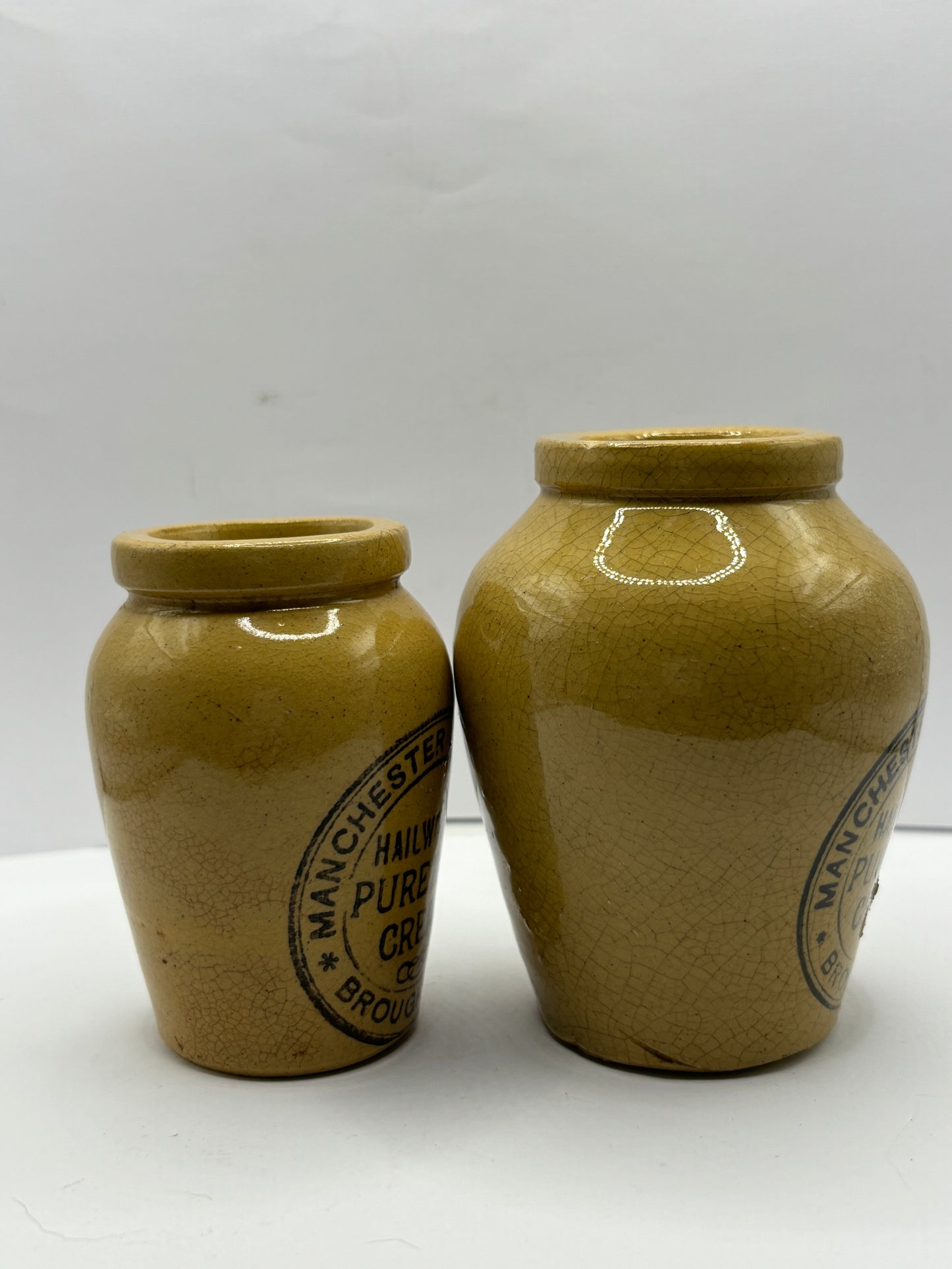 2 advertising cream pots, Stained & crazed