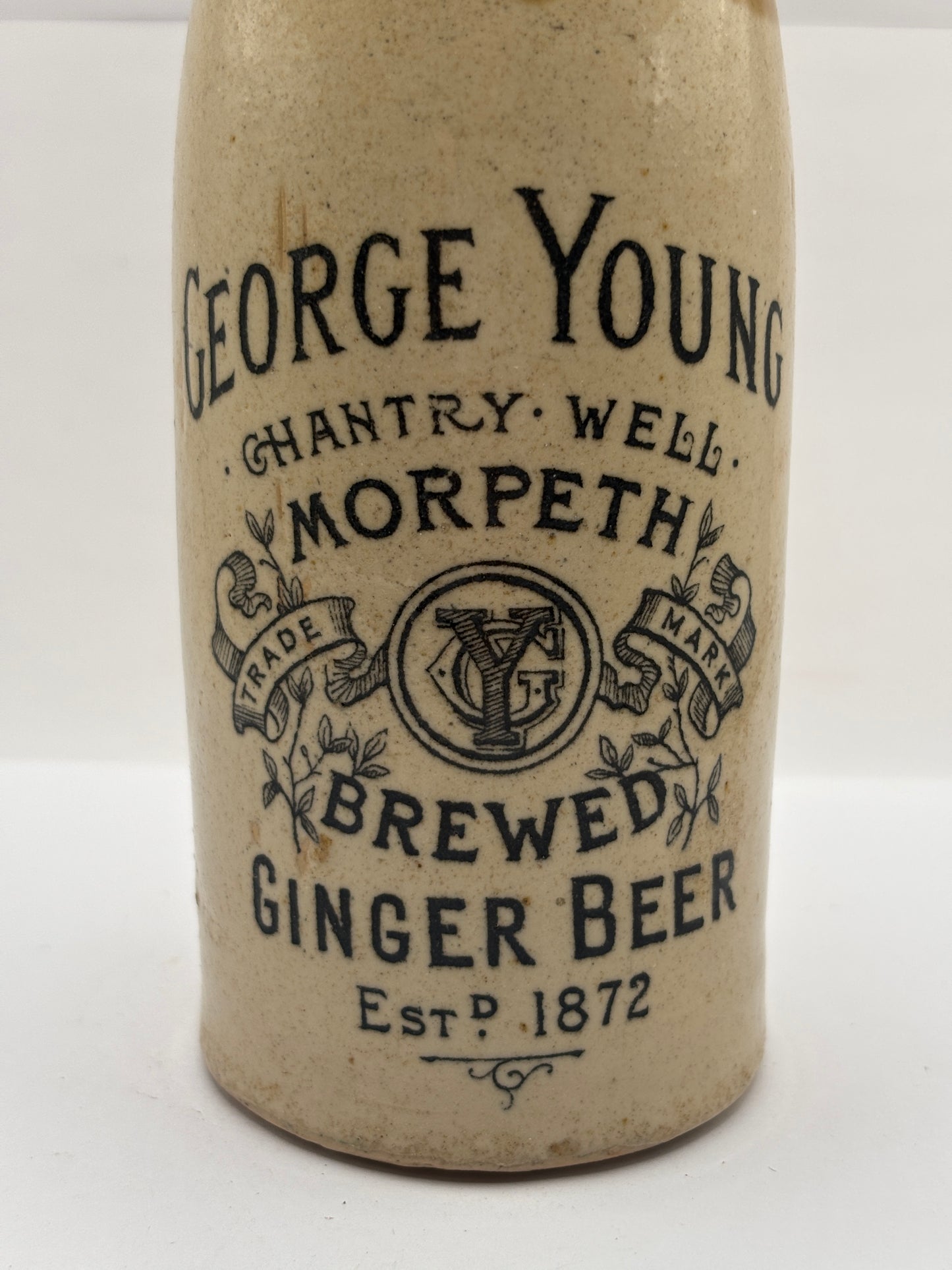 Old stoneware ginger beer bottle, George Young. Morpeth brewed ginger beer. Original stopper