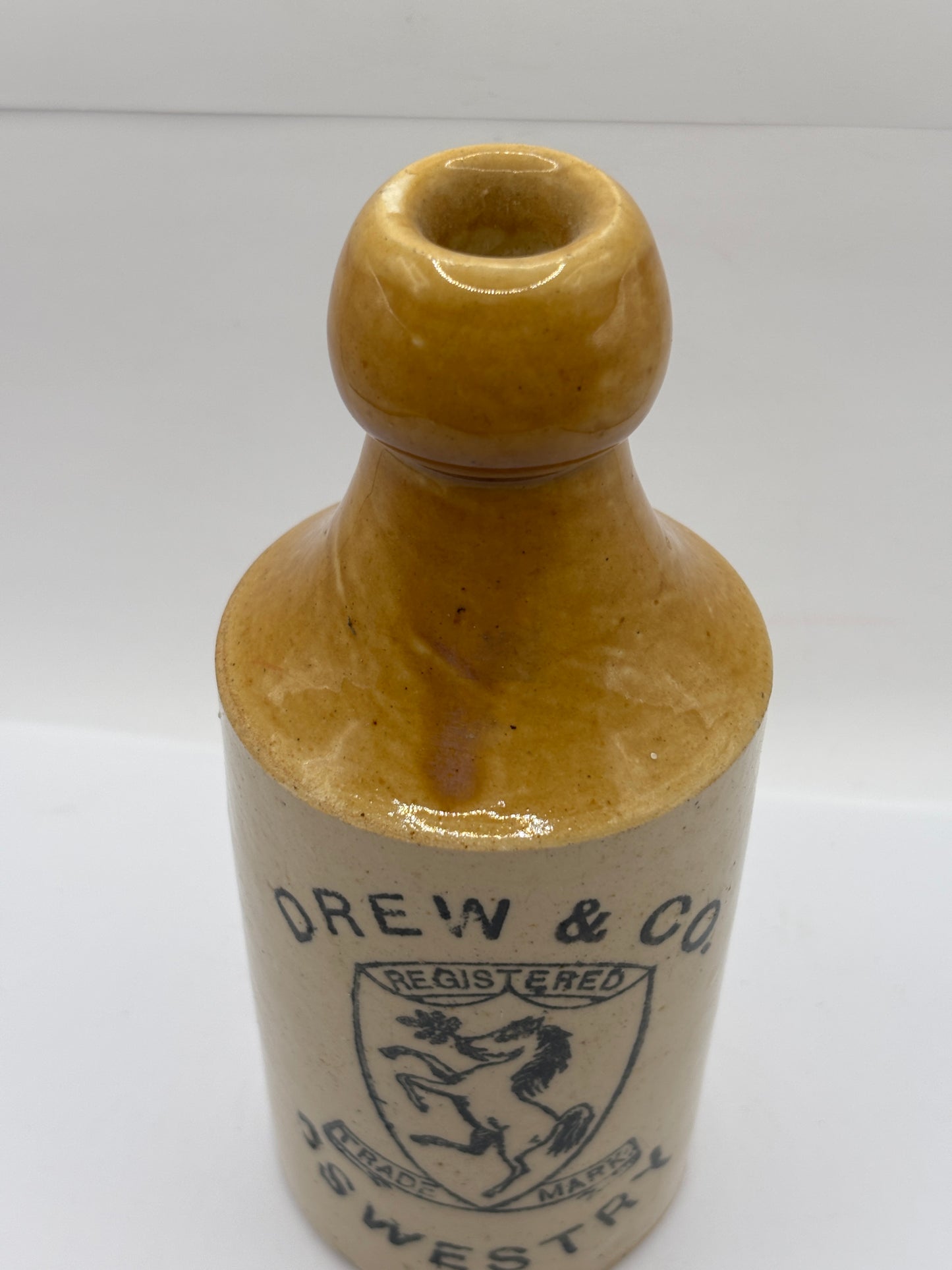 Old stoneware ginger beer bottle, Drew & Co. Oswestry