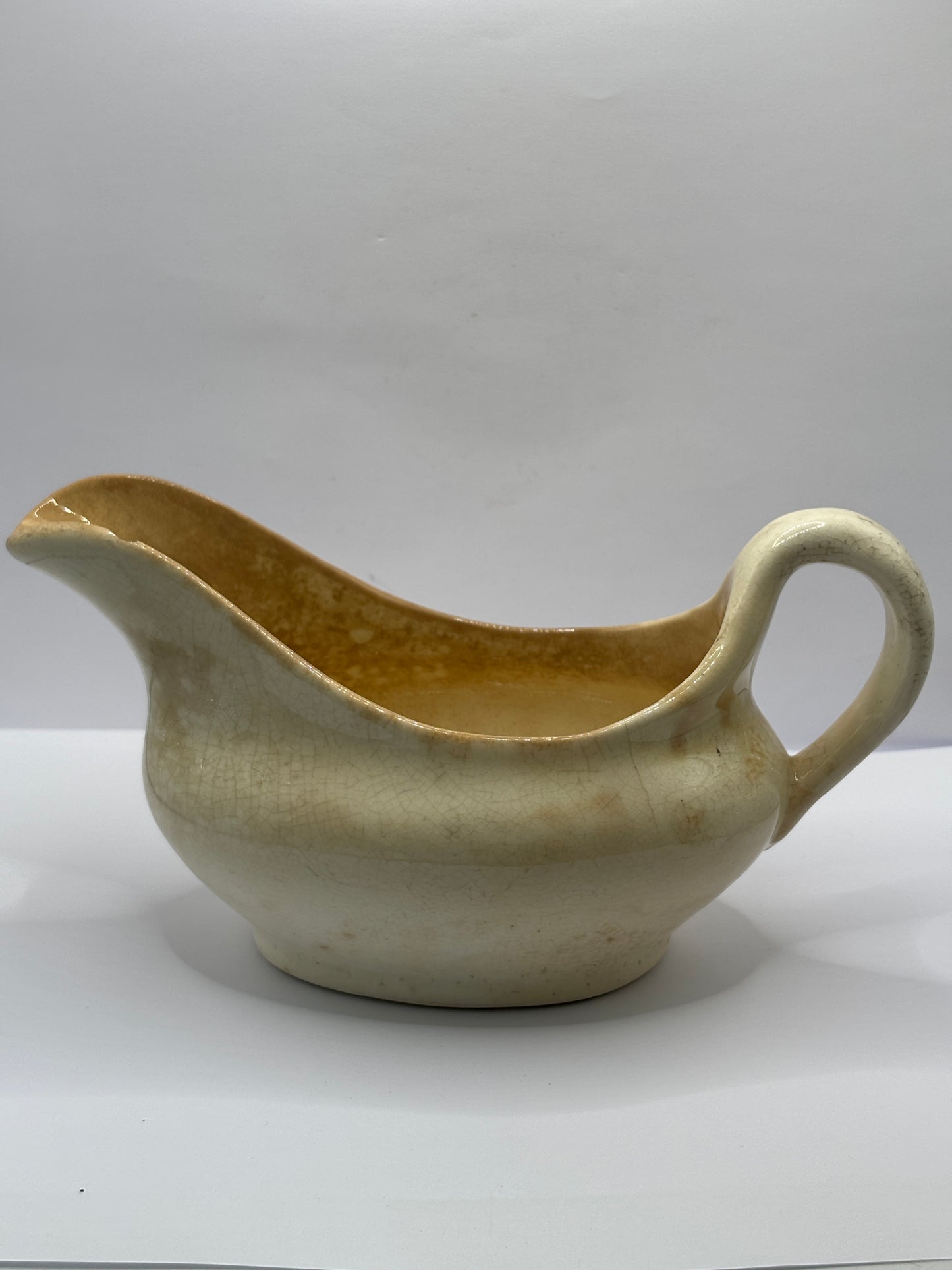 Old stained & crazed handled jug, gravy boat