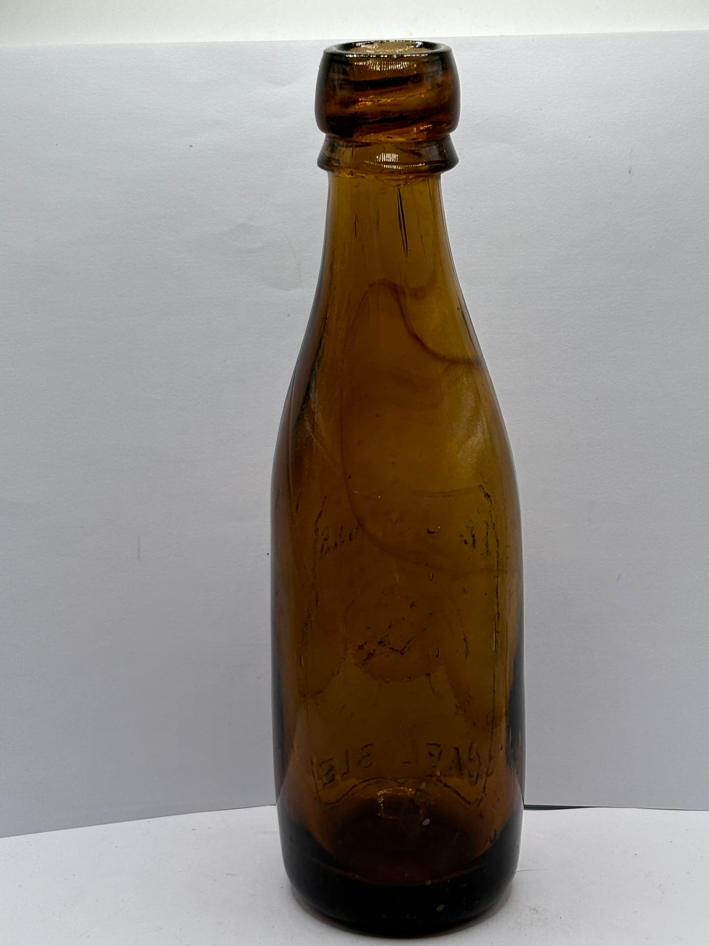 Old amber glass beer bottle, T&J minns Carlisle