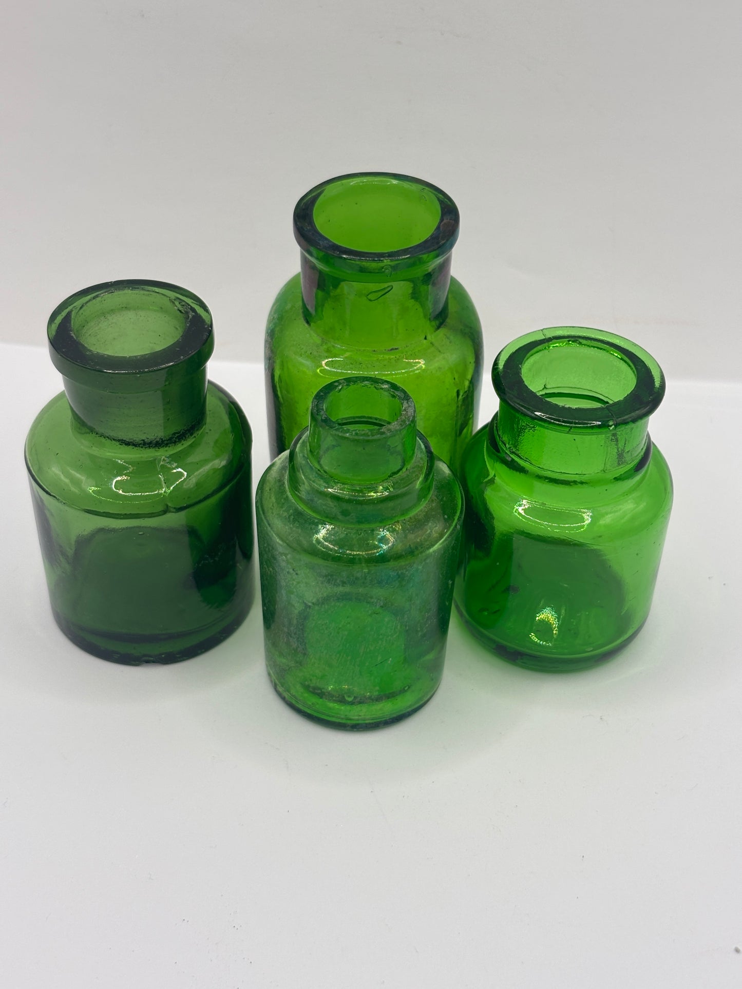 4 old green glass jars