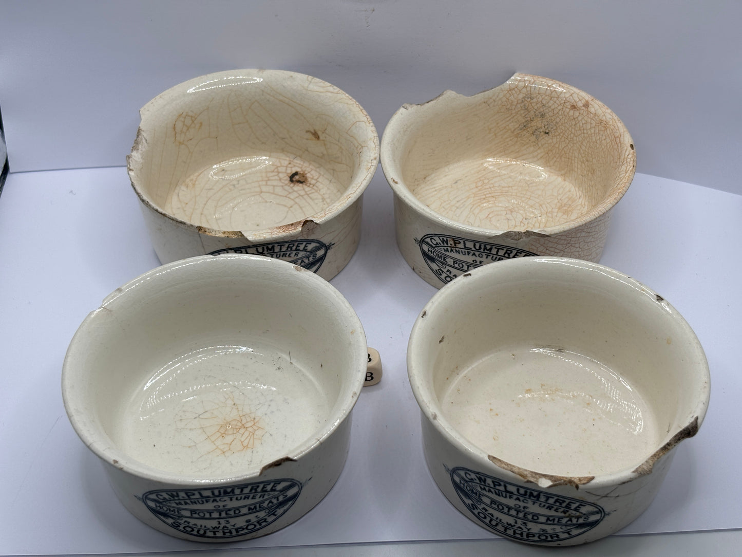 4 old advertising meat paste pots (B) damaged