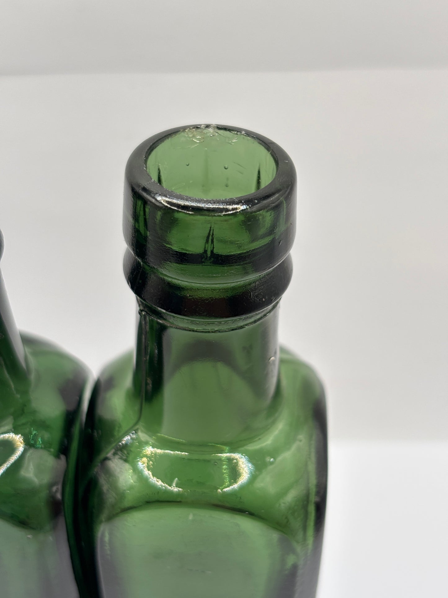 2 old green glass coffee essence bottles