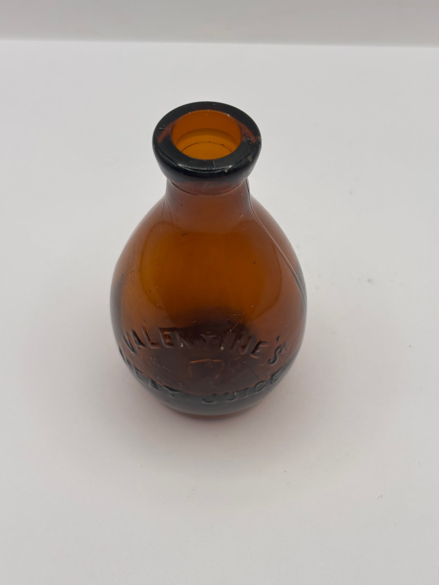 Old amber glass bottle, valentines meat juice