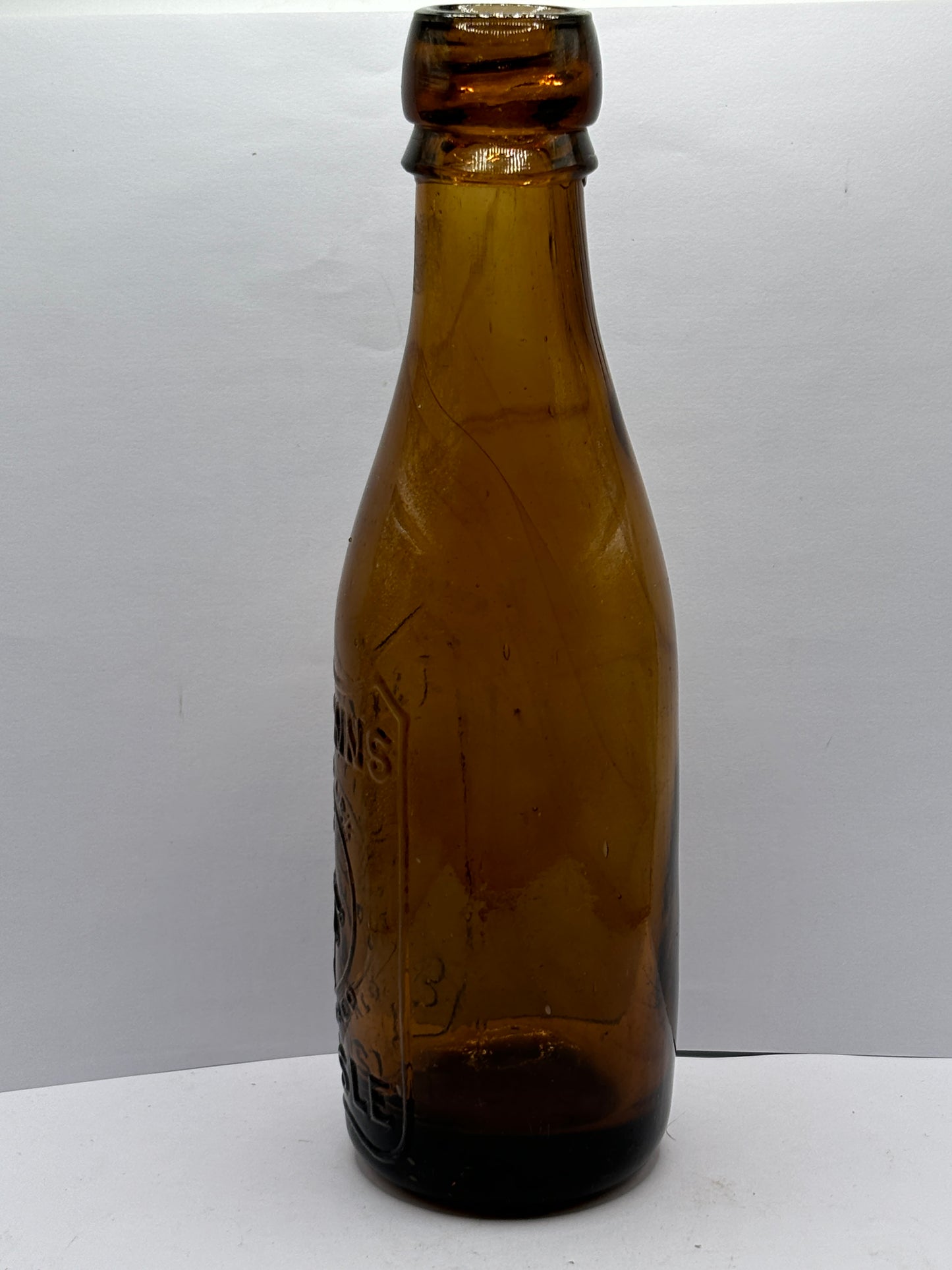 Old amber glass beer bottle, T&J minns Carlisle