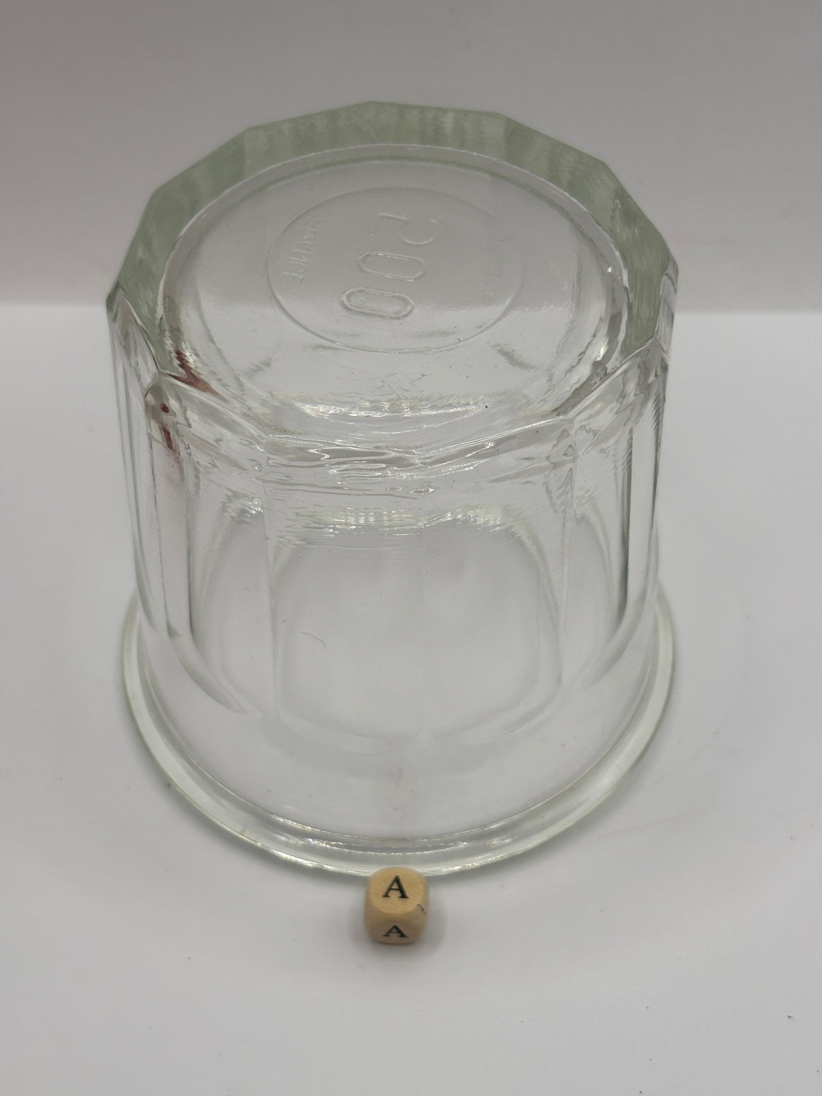 Old clear glass French jam jar (a)