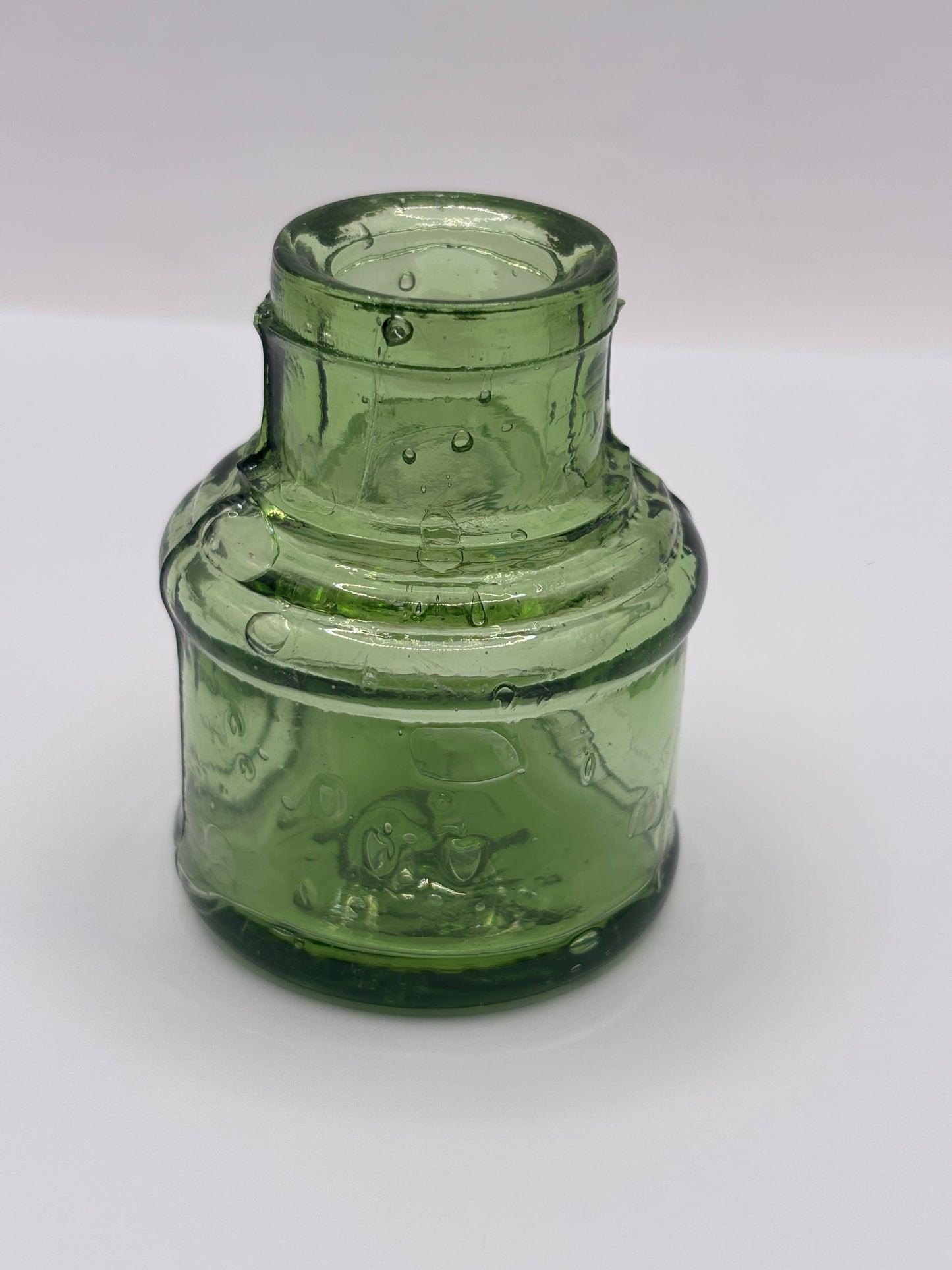 Old green glass ink bottle, inkwell