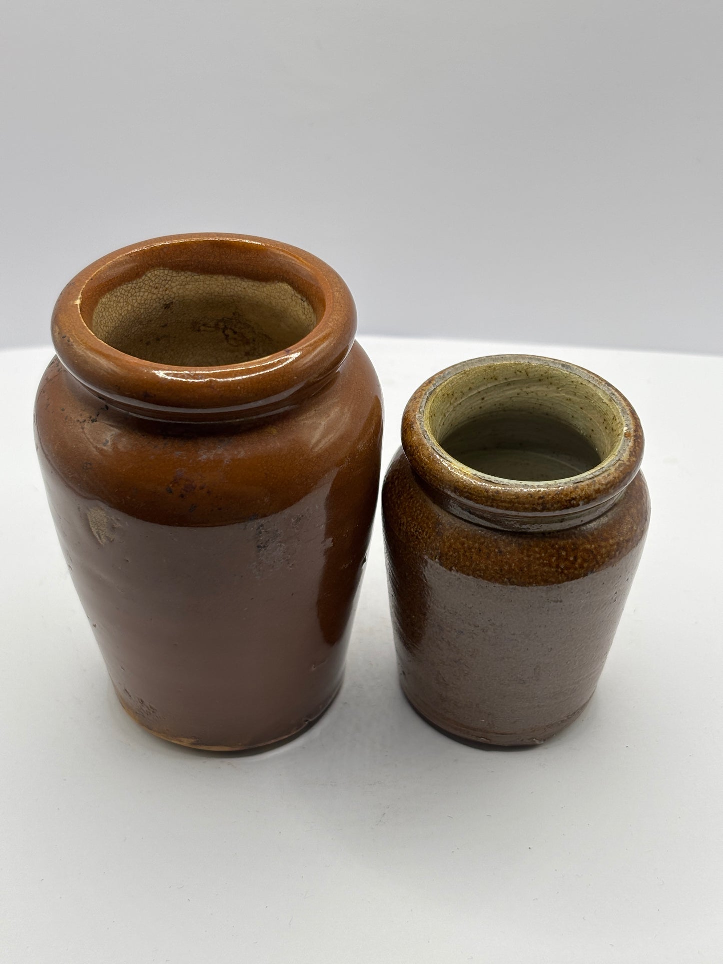2 old brown stoneware cream pots