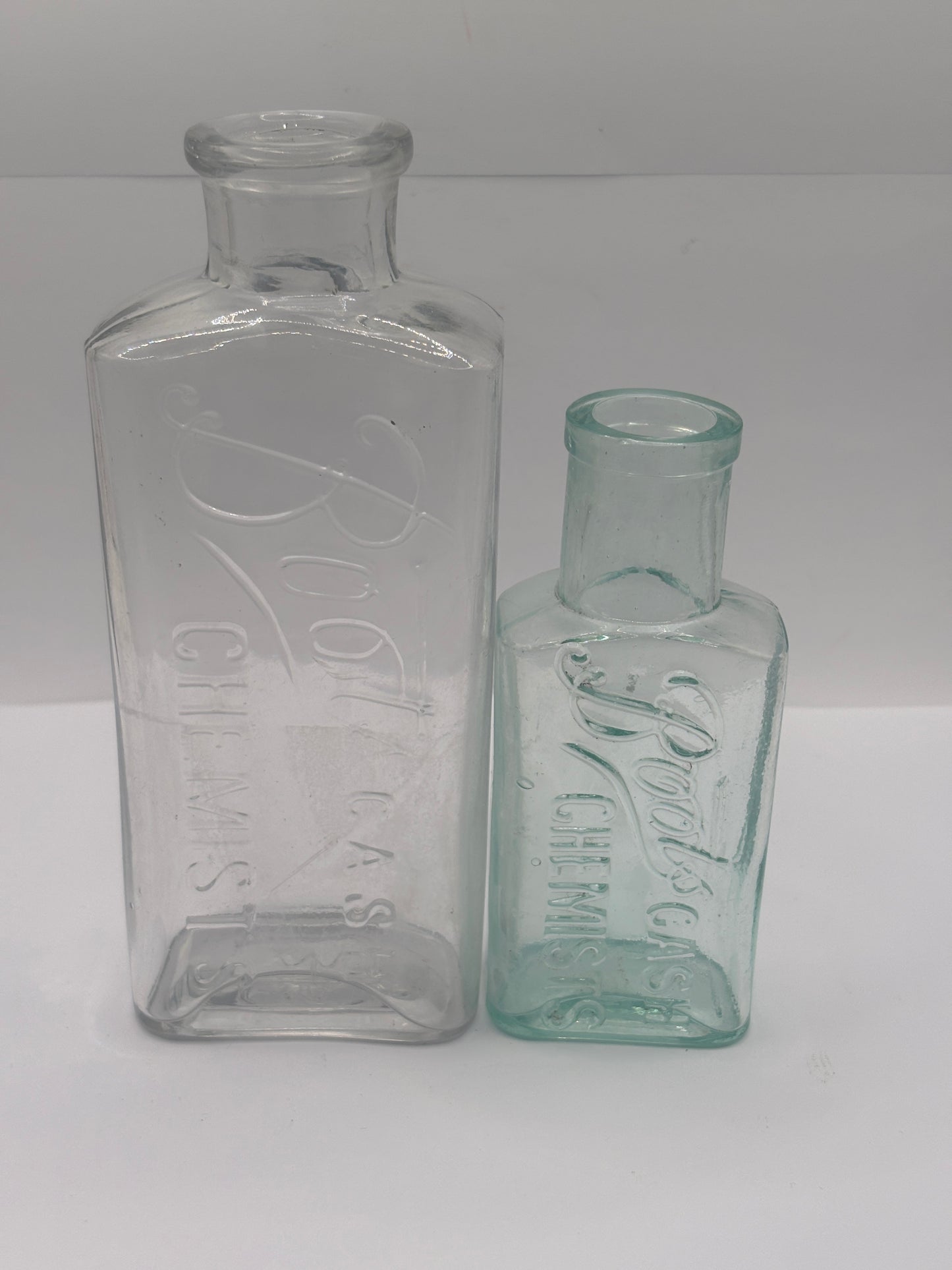 2 Old glass Boots cash chemists bottles