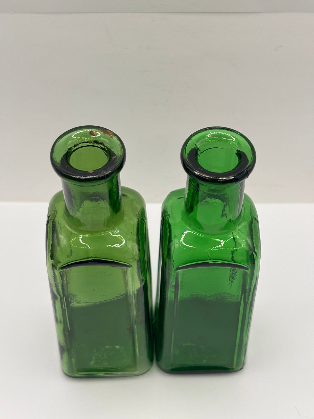 2 old green glass IZAL bottles