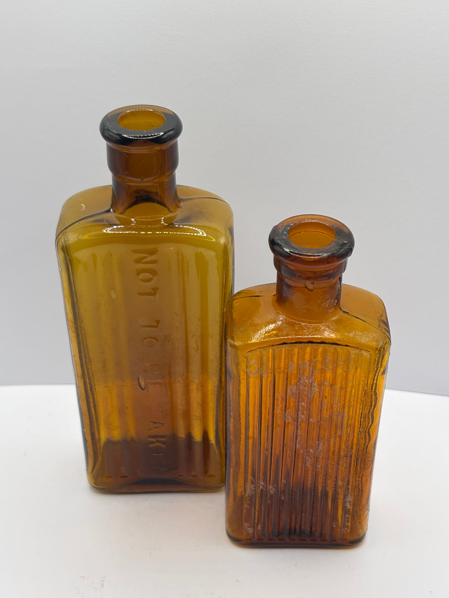 2 old amber glass poison bottles, not to be taken