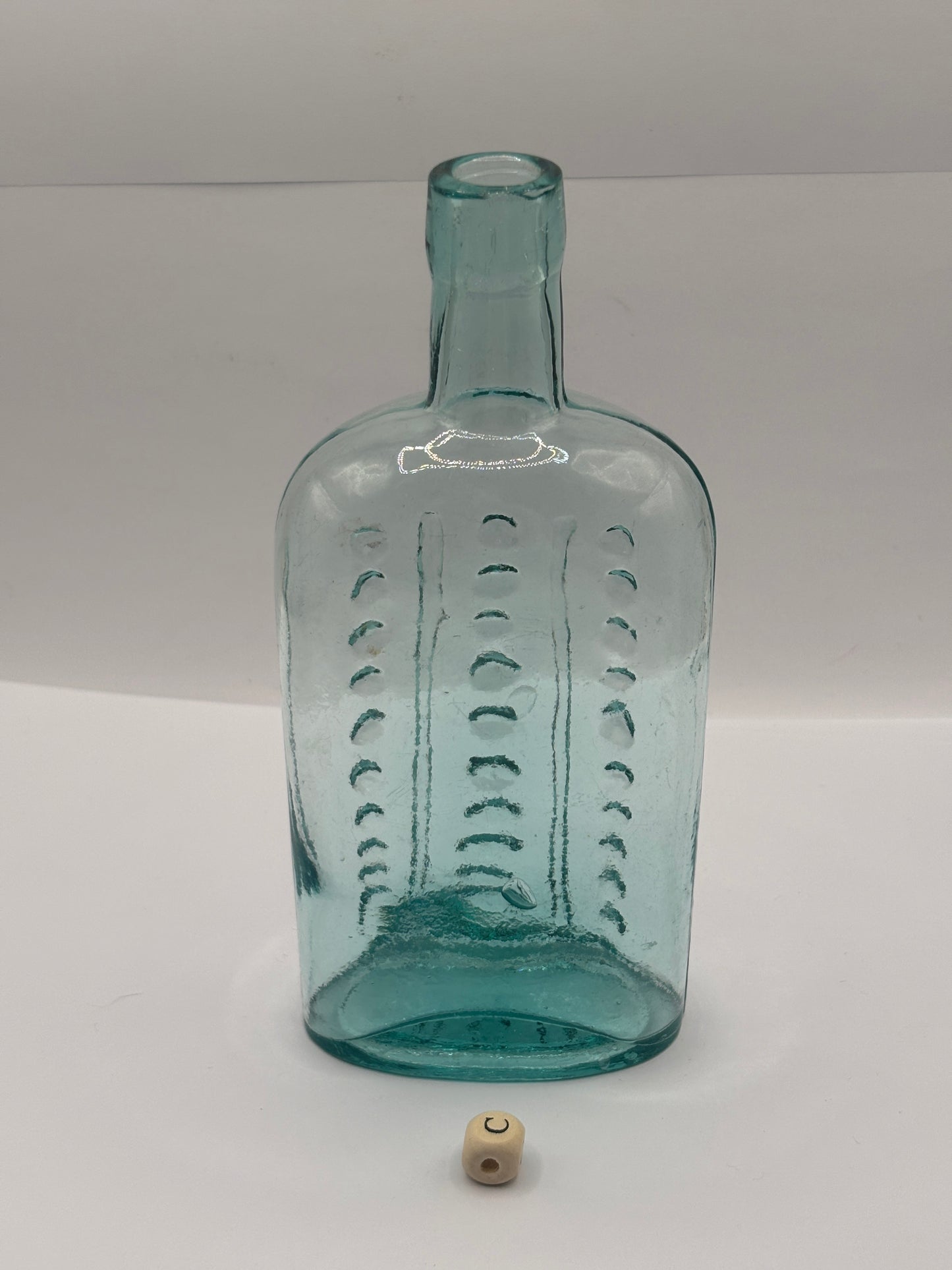 Old aqua glass poison bottle, (c)