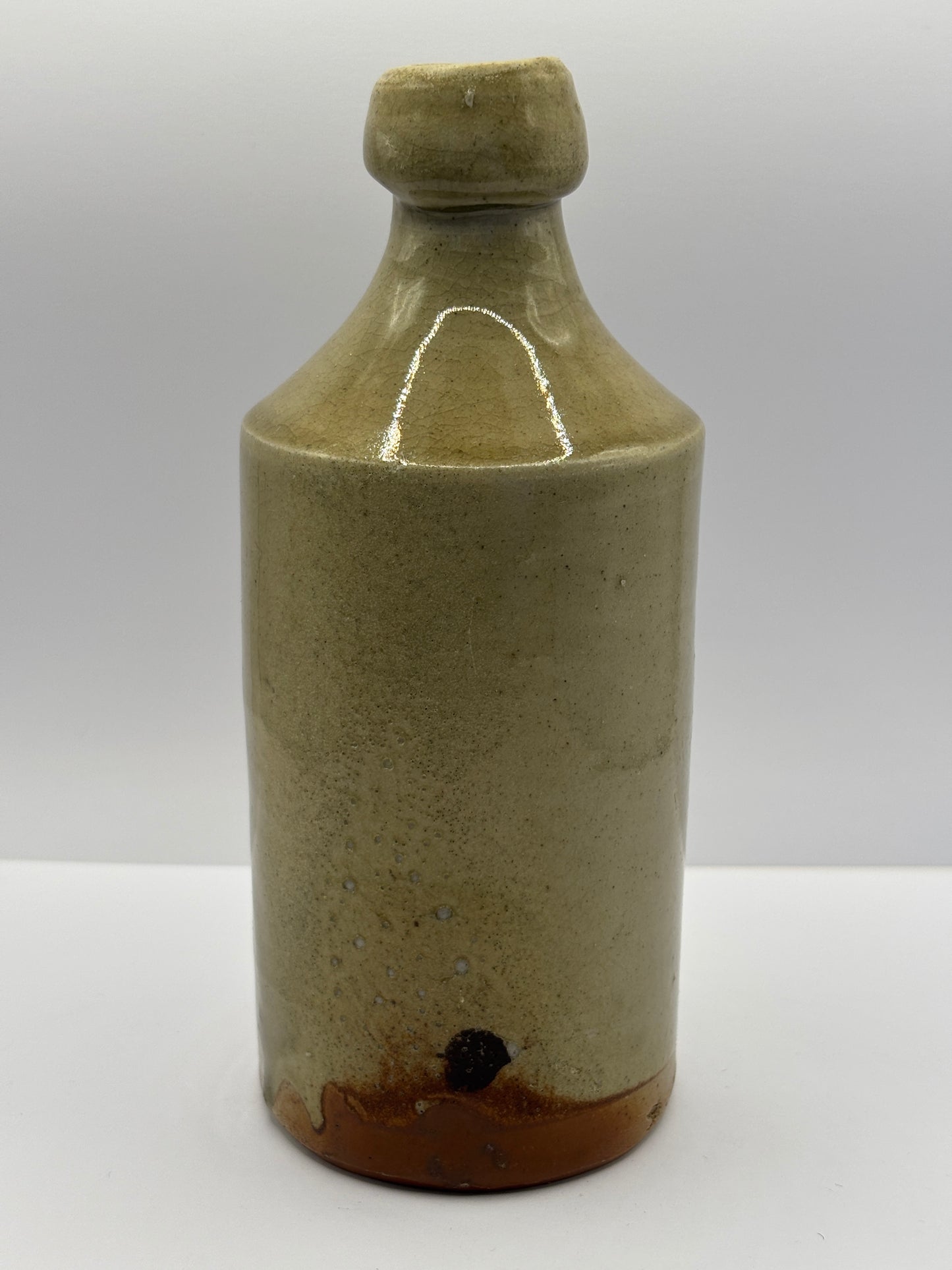 Early plain stoneware ginger beer bottle