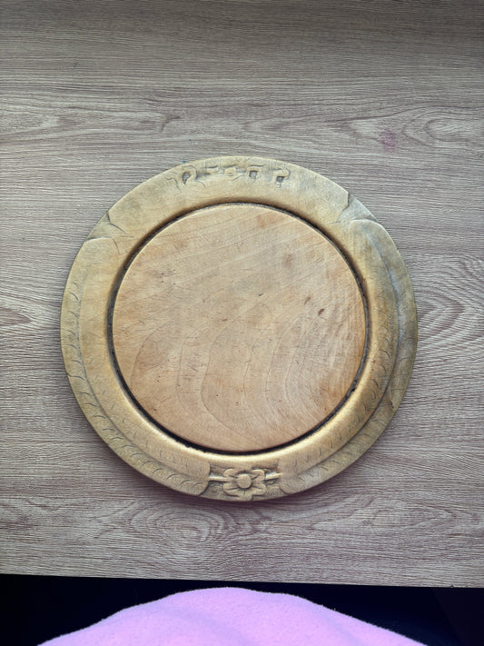 Old wooden carved bread board