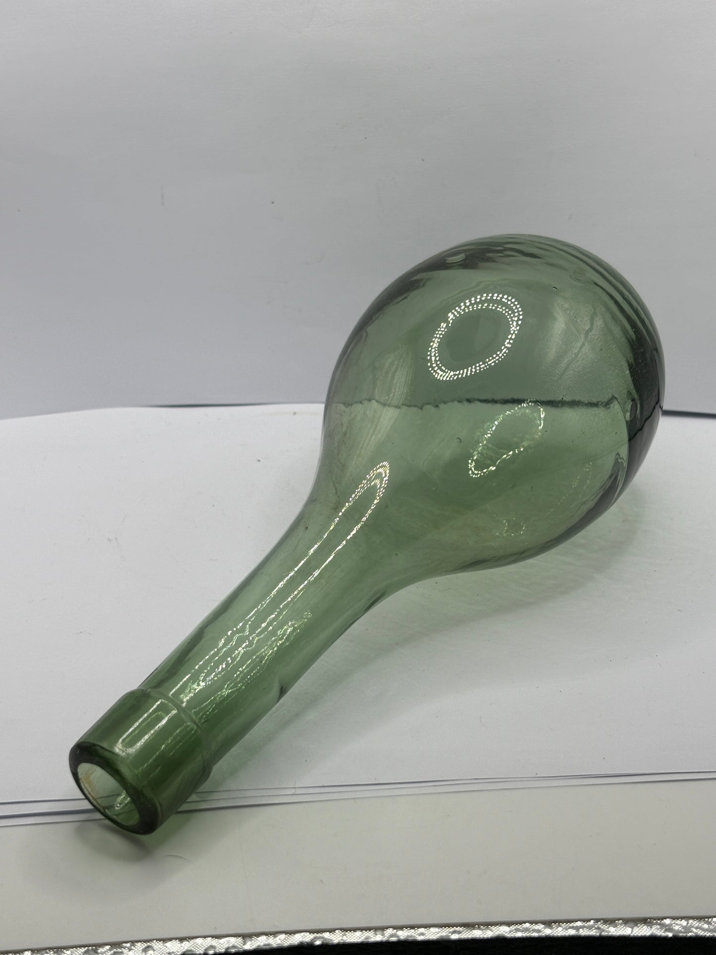 Old round bottom aqua glass bottle