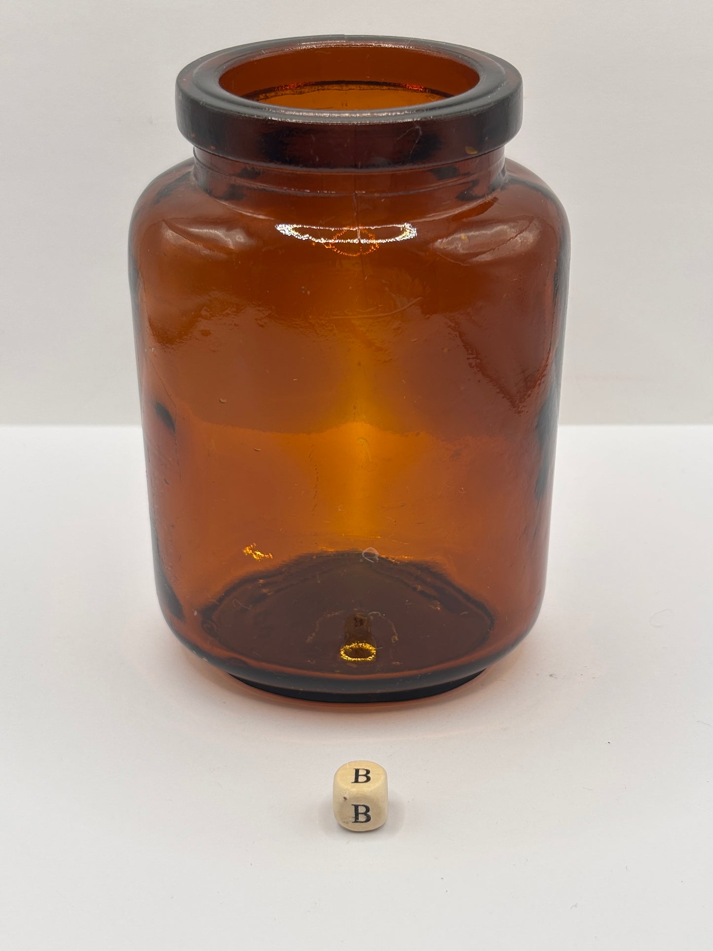 Old amber glass jar (B)
